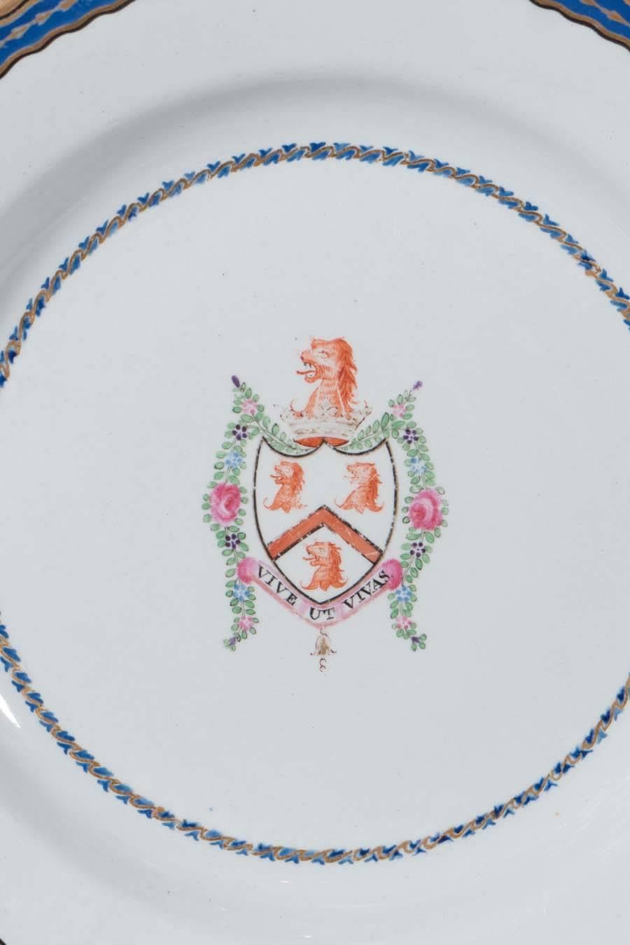 A set of a dozen Spode armorial dishes made in the Chinese Export style, circa 1820. The center features the armorial shield of the Family of Hall displaying
a lion's head erased above a shield with a chevron between three lion's heads erased. The