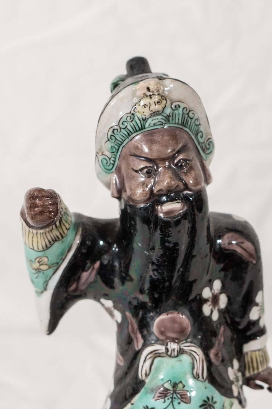 A small 19th century Chinese statue of Guan Yu, one of the eight Chinese Immortals. Guan Yu was an army marshal who on retirement took to a hermit's life in the Yangjiao mountains of Hunan in the Three Kingdoms period. In Chinese tradition Guan is