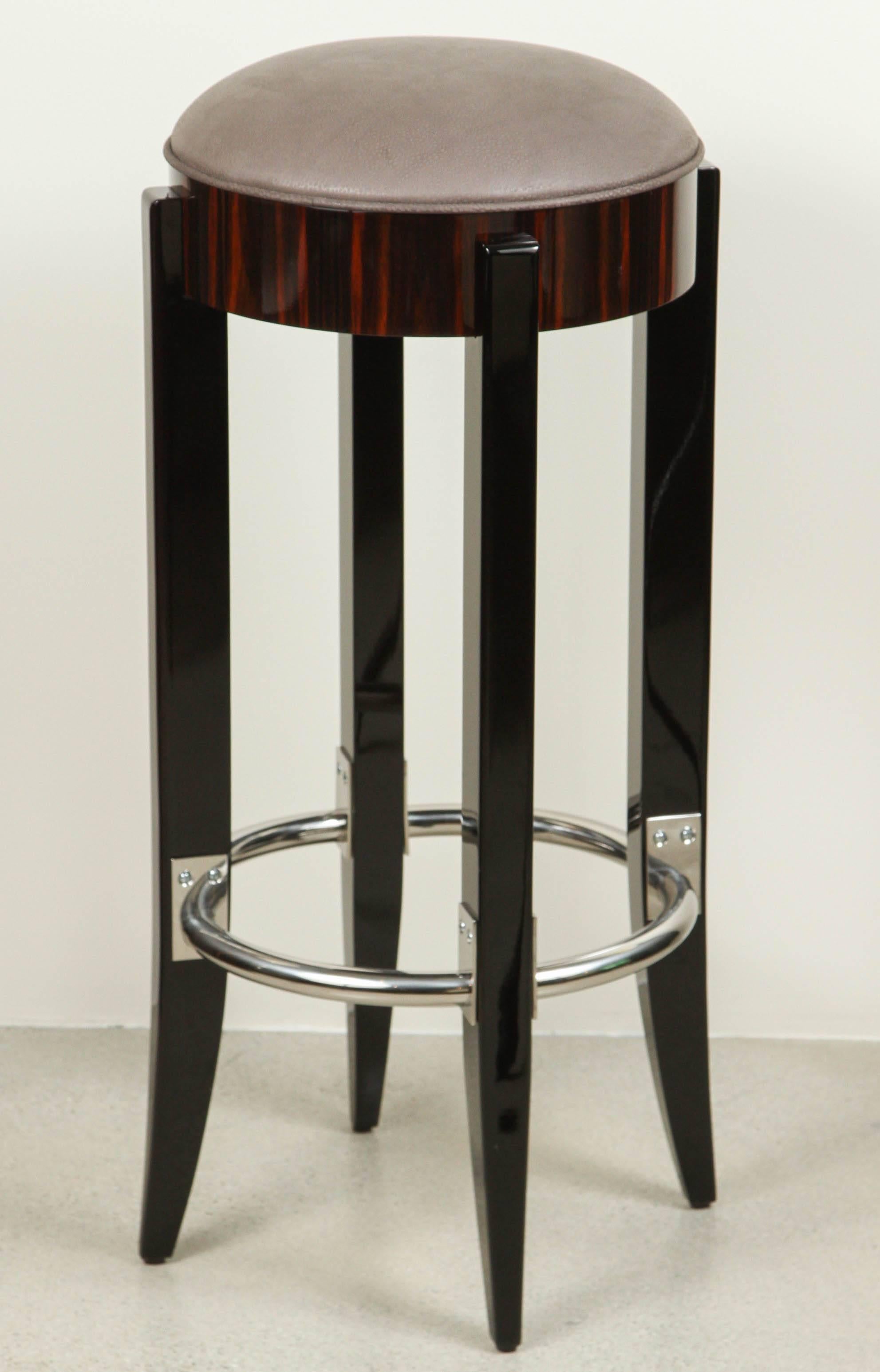 Fine German furniture maker, Cygal Art Deco, reinvents an old and proven Classic piece after Jacques Emile Ruhlmann design. It stands on solid timber legs in black high gloss, in contrast to the Macassar seat. This comfortable bar stool is