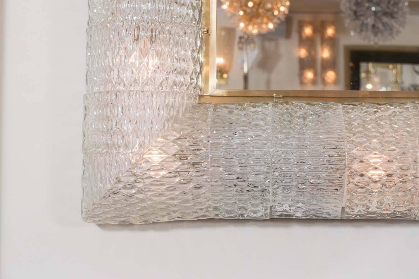 Monumental square mirror featuring illuminated textured Murano glass elements surround in the style of Barovier.