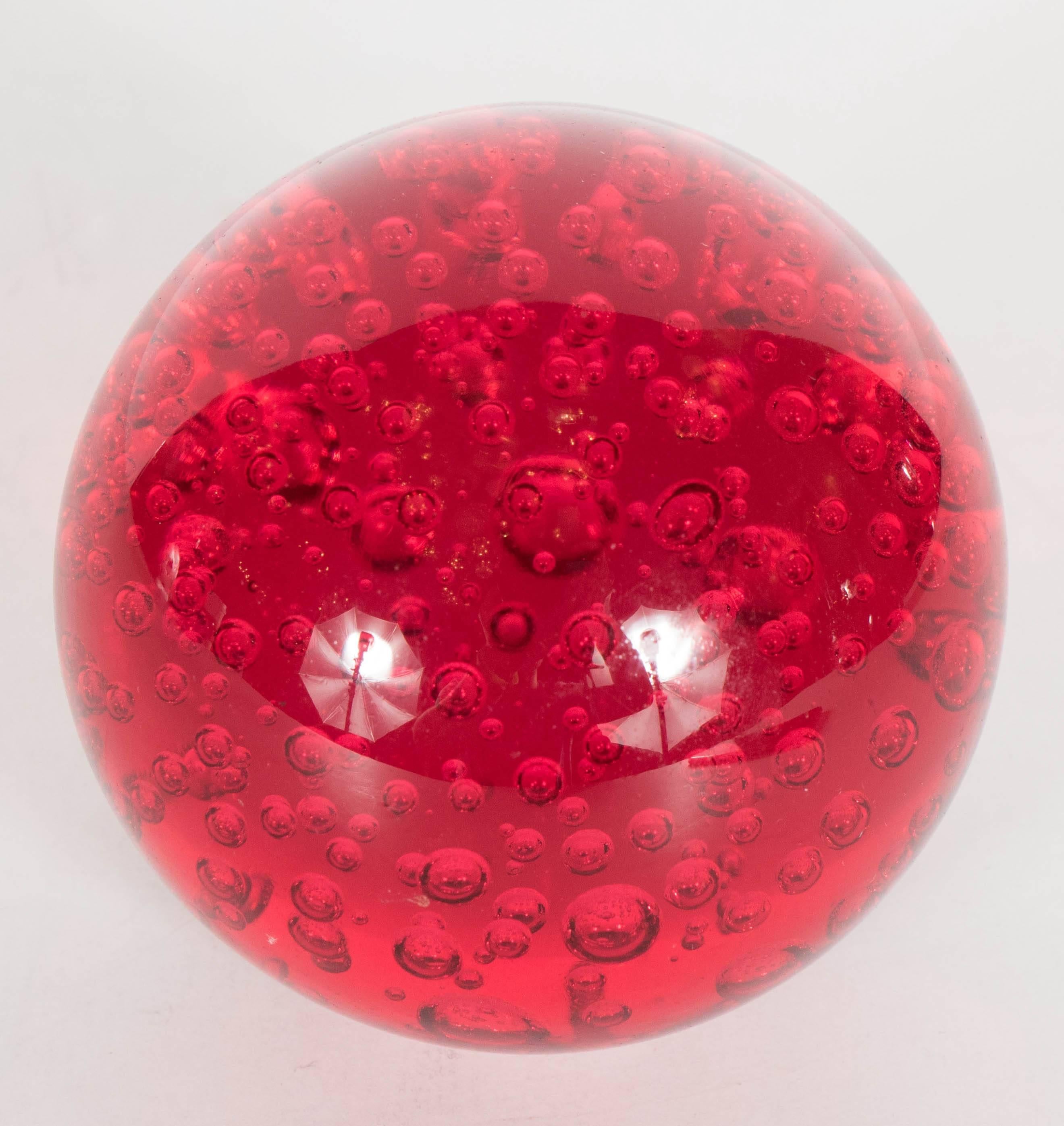 red glass paperweight