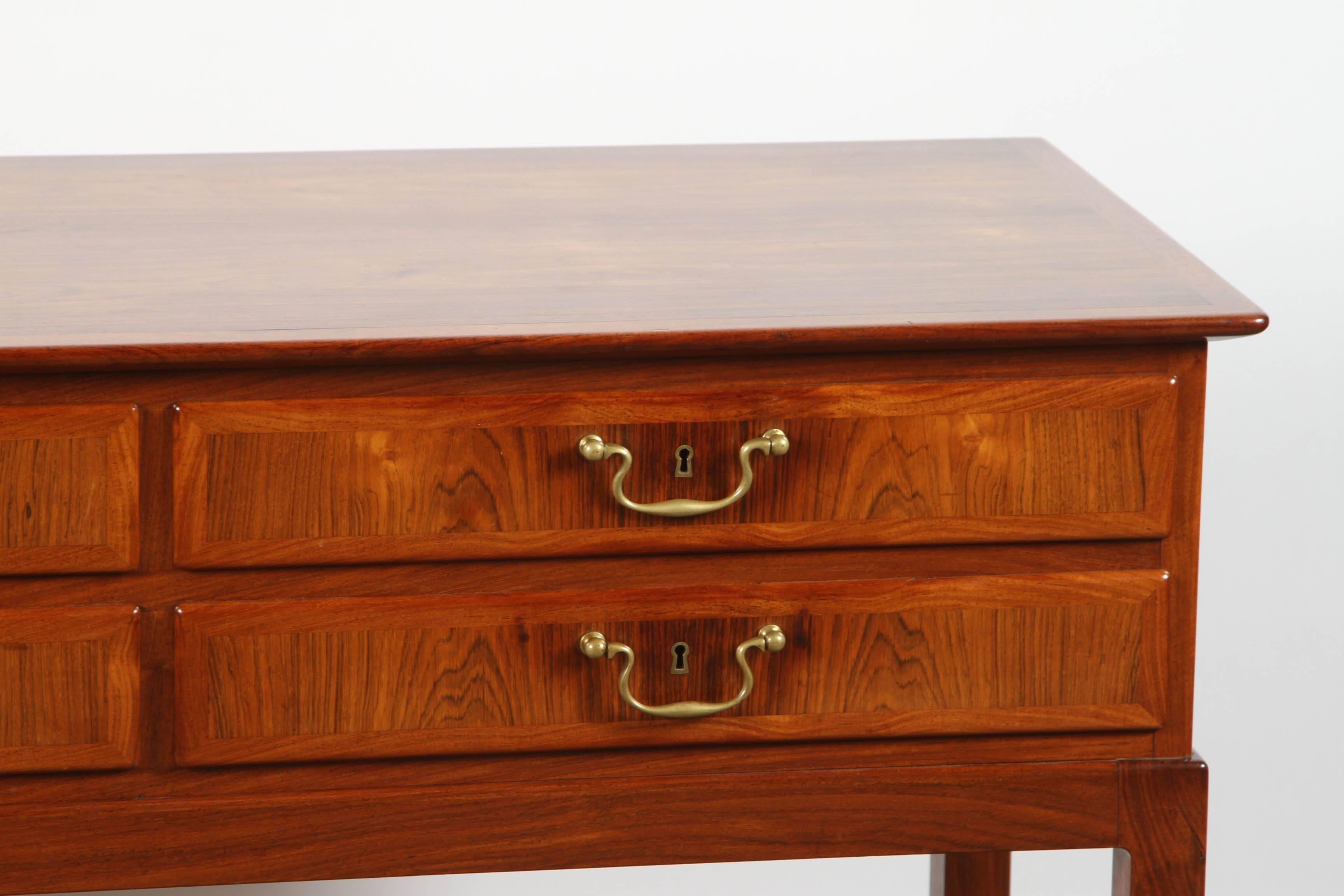 Four drawers with English inspired handles, resting on an Asian inspired support.