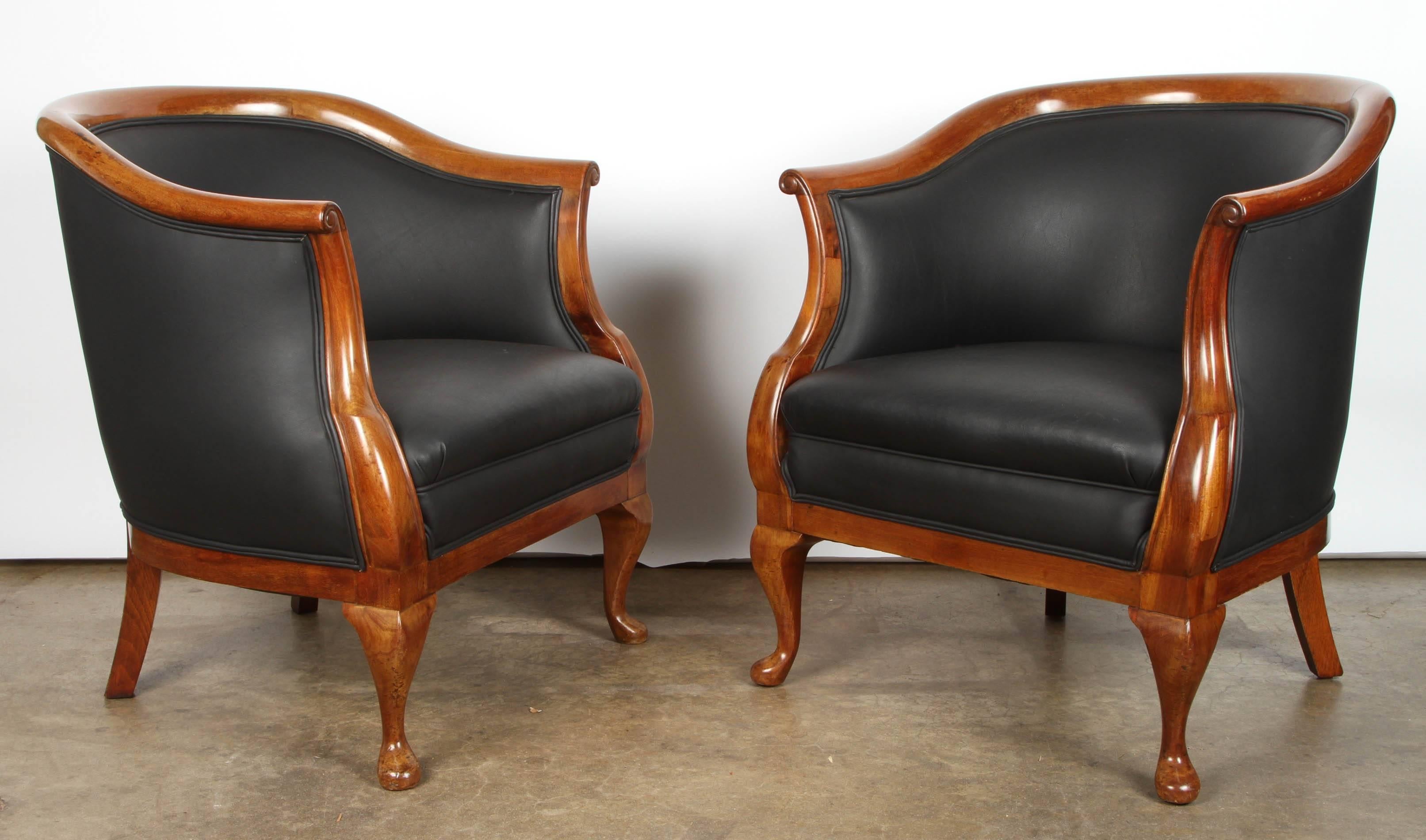 Danish mahogany armchairs with new leather upholstery, circa 1930s.