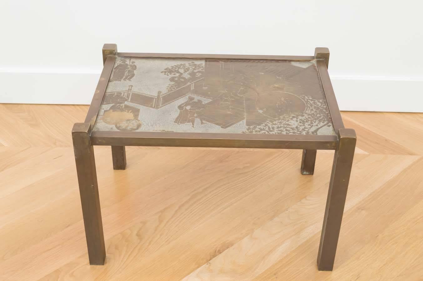 All original Tao side table, etched and patinated bronze with pewter overlay. Signed on top of table.
There is some discoloration and wear to the top, do to age and use.