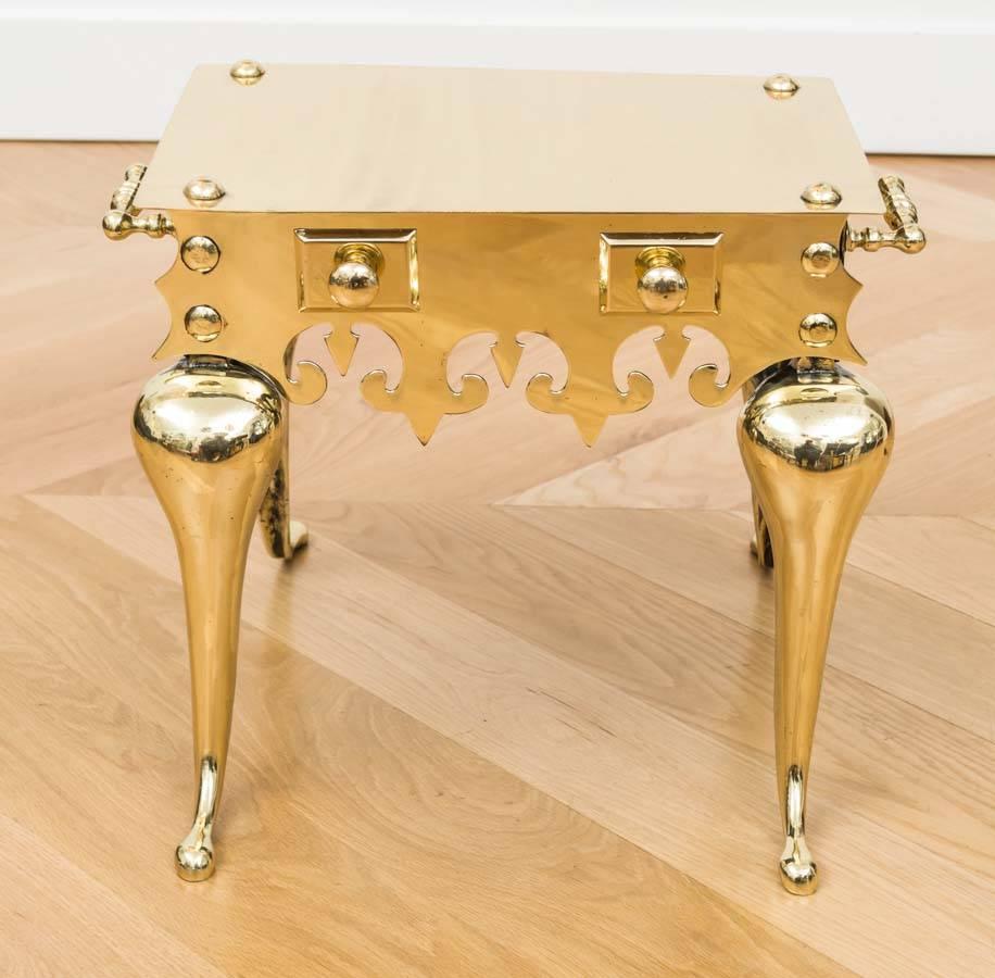 Decorative polished brass side table.