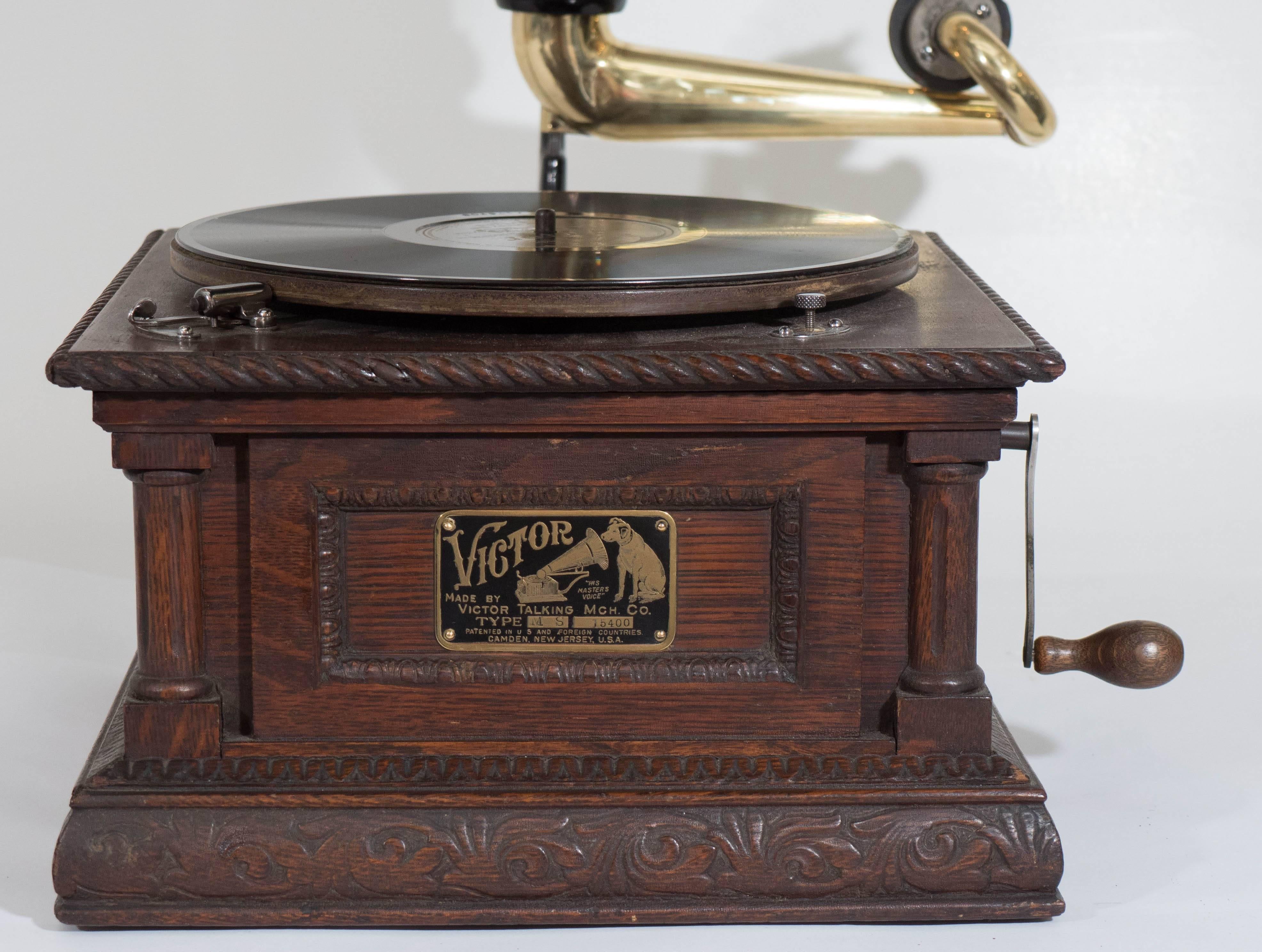 An early 20th century phonograph, produced by The Victor Talking Machine Company of Camden, New Jersey, circa 1904-1905. The 'Monarch Special' model is distinguished by the ornately carved oak base, the most highly decorated phonograph from this