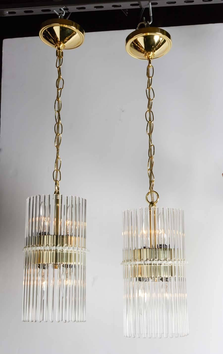 Polished Pair of Mid-Century Modern Glass Rod Pendant Chandeliers by Lightolier