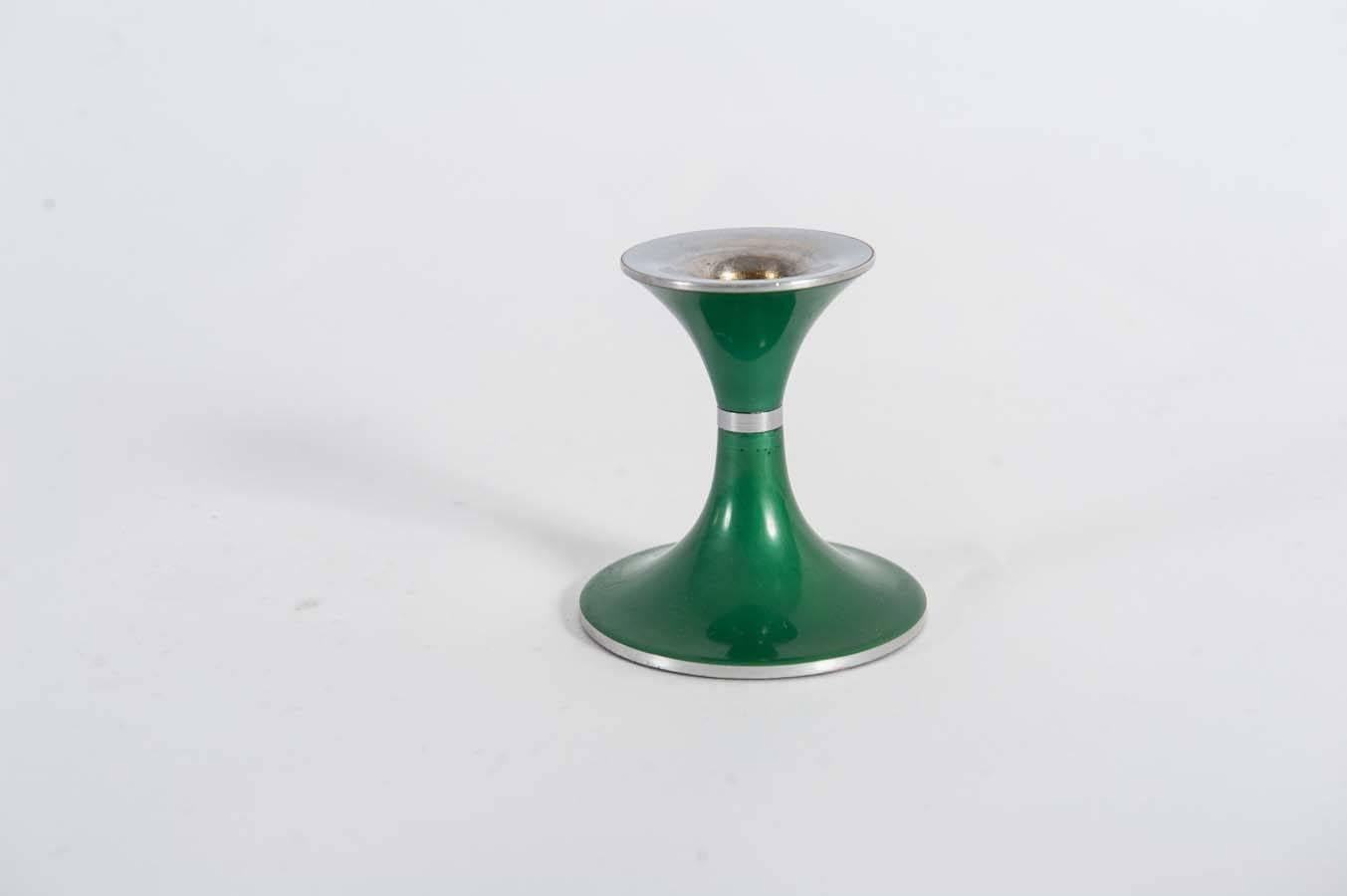This pair of candlesticks is made of aluminium with a layer of green enamel. 
They are made by Emalox Norway and were sold by Quist Präsente which is also marked on the bottom.