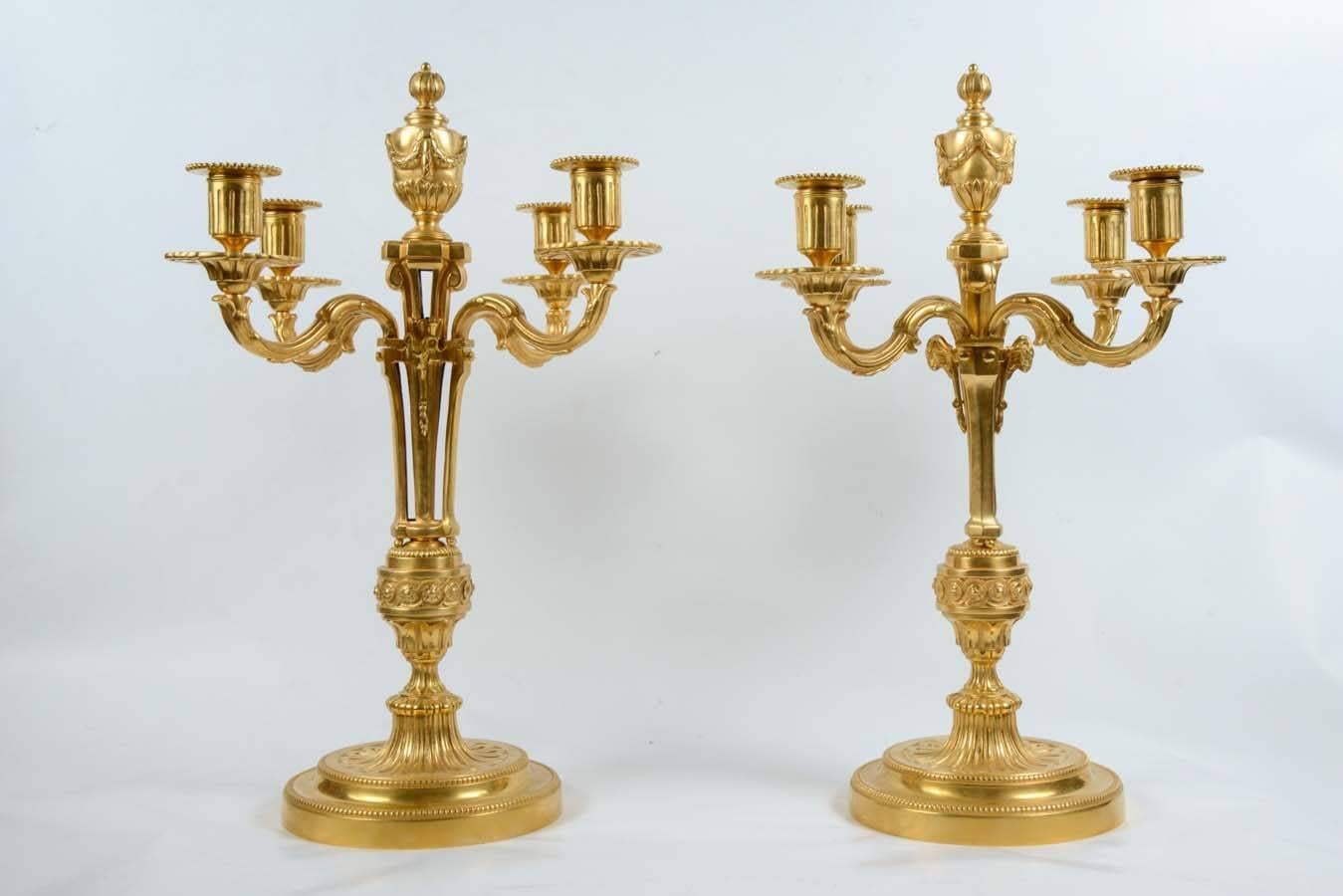 Pair of candelabra, four arms for candles - bronze gilt with real gold.
