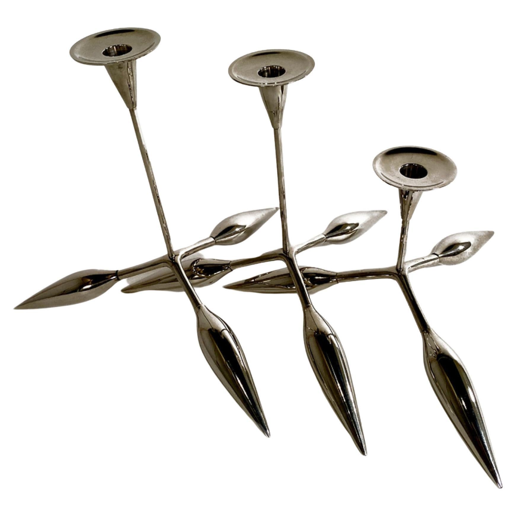 A Set of 3 Italian Modern Chrome Candle Sticks