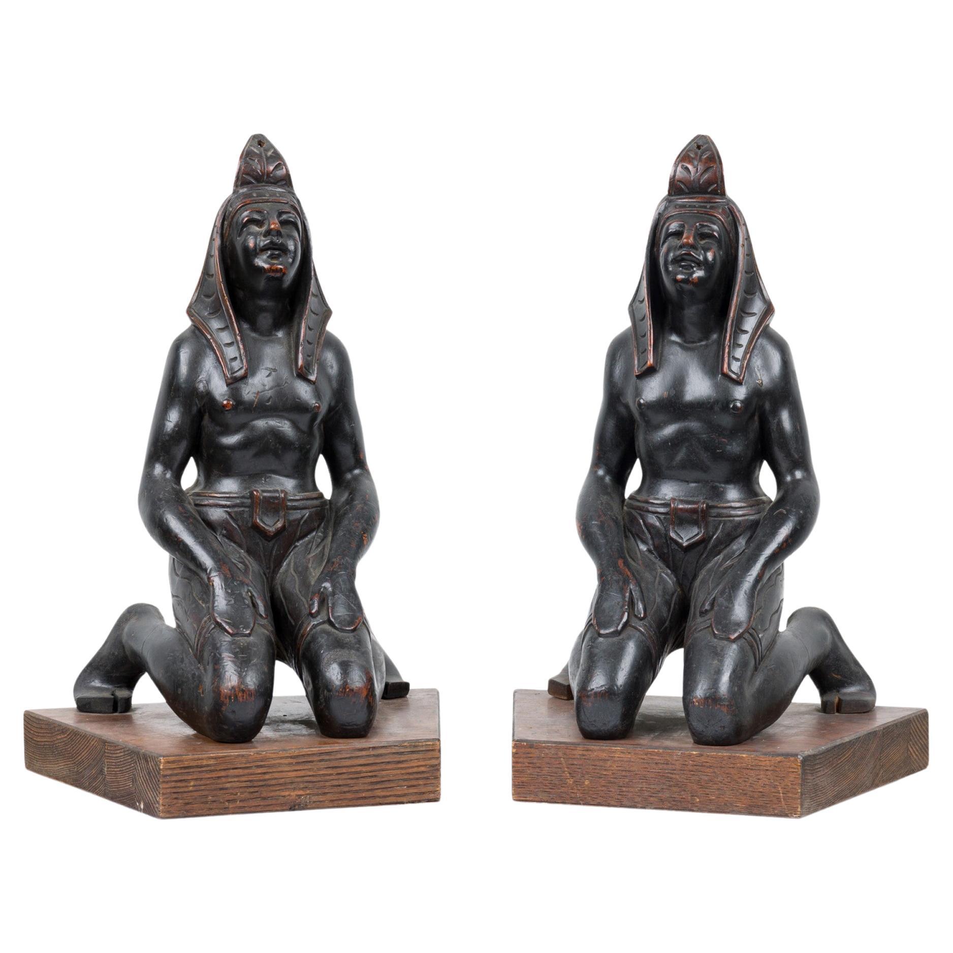 Pair of Egyptian Carved Ebonized Kneeling Figures For Sale