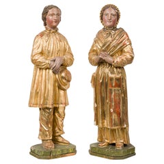 Coppia di statue italiane intagliate, dipinte e dorate, CIRCA 1850