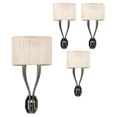 Ensemble de 8 appliques à deux lumières en nickel, à la manière de Ruhlman