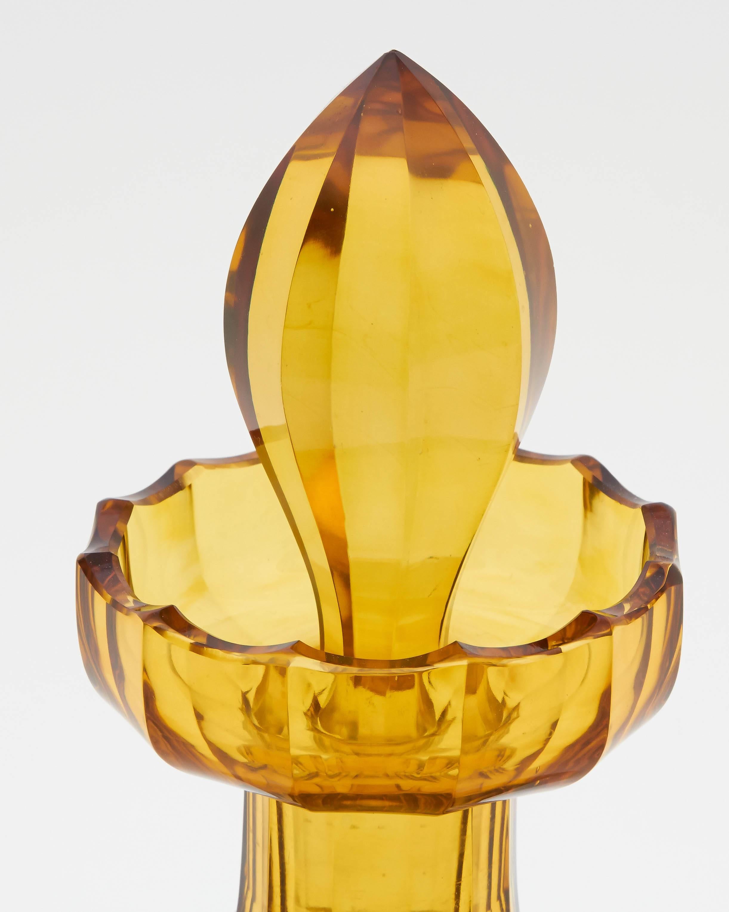 Antique English decanter. This 1870s decanter is in amber-colored glass. The design is very elegant for a bar story or dinner party.