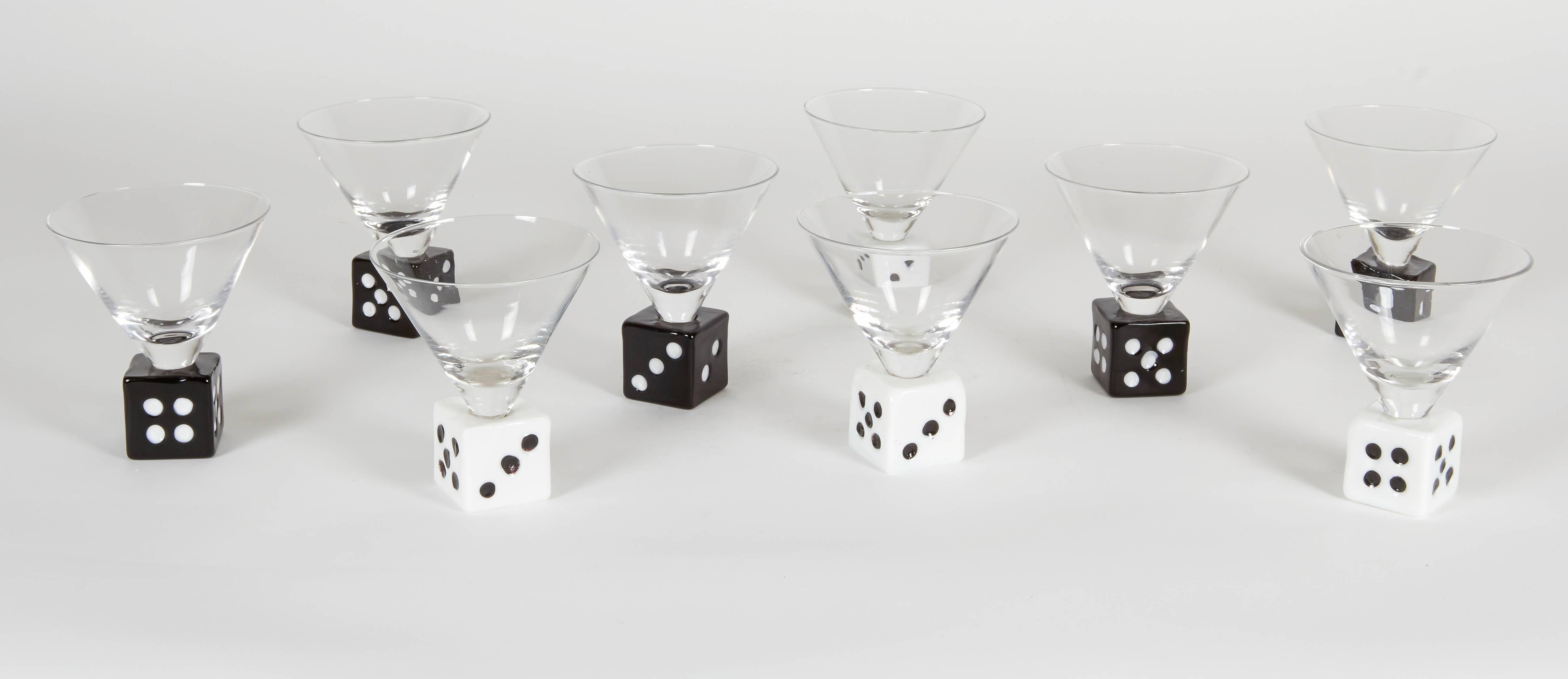 Set of nine vintage martini glasses with a dice base. The set includes four white and five black glasses. A must for entertaining on game night.