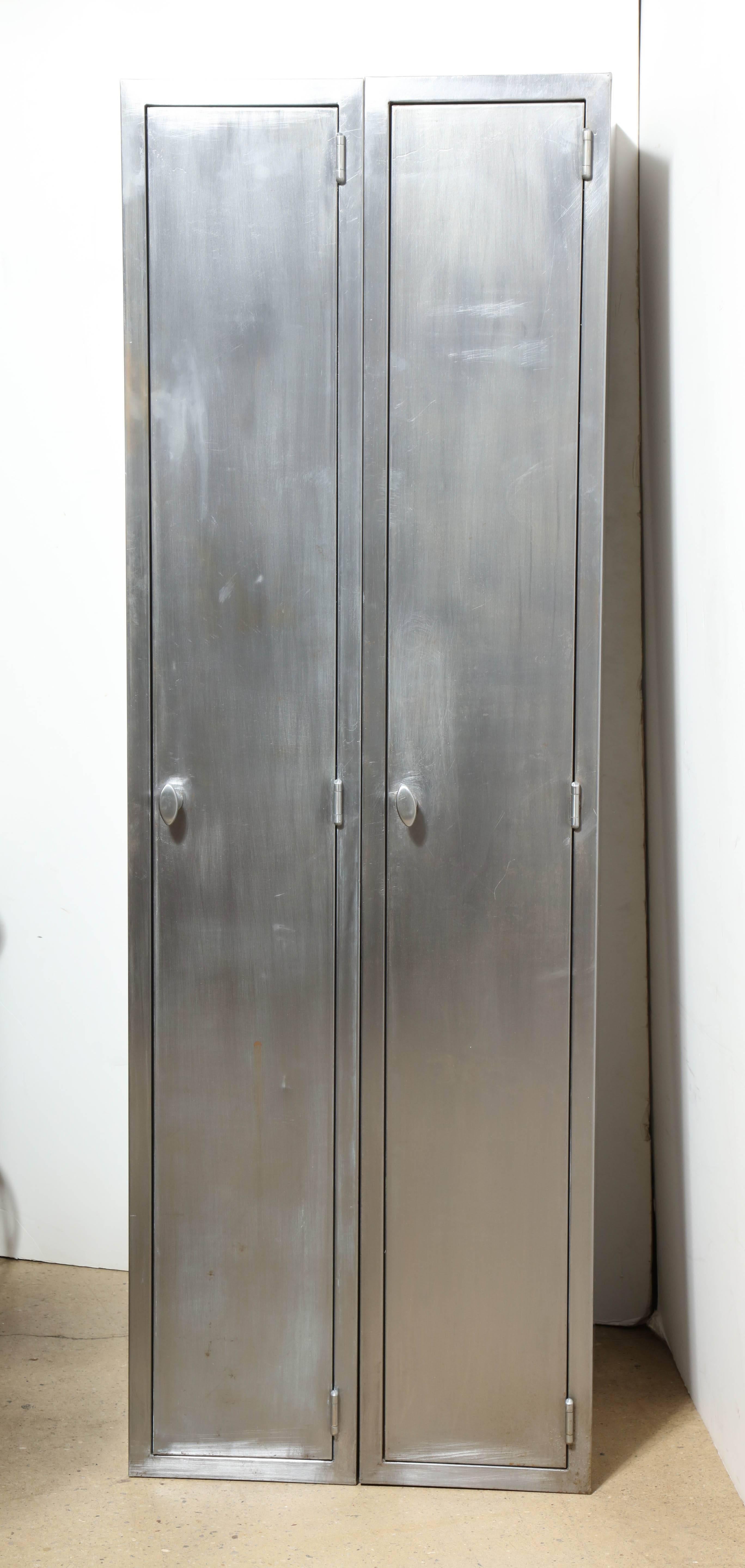 Two Mid-Century, Brushed Steel Lockers.  Featuring a slim rectangular form with superb quality heavy gauge Steel, nice hardware, 12