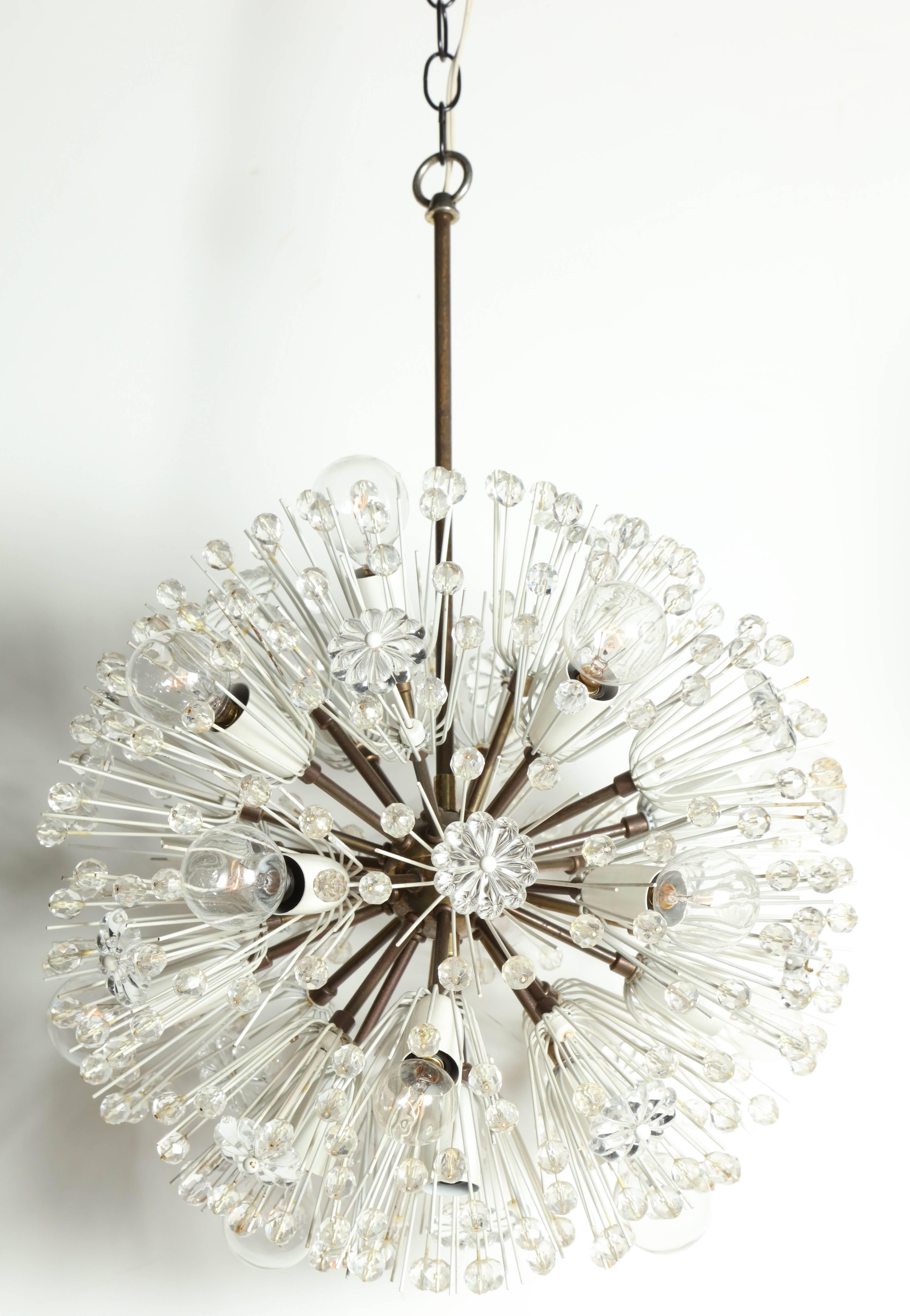 European Modern Emil Stejnar for Rupert Nikoll Hand Cut Crystal Sputnik Chandelier. Featuring a suspended and looped Brass rod with interior, spherical Brass Sputnik form with original patina, thin enameled posts, transparent hand crafted crystal