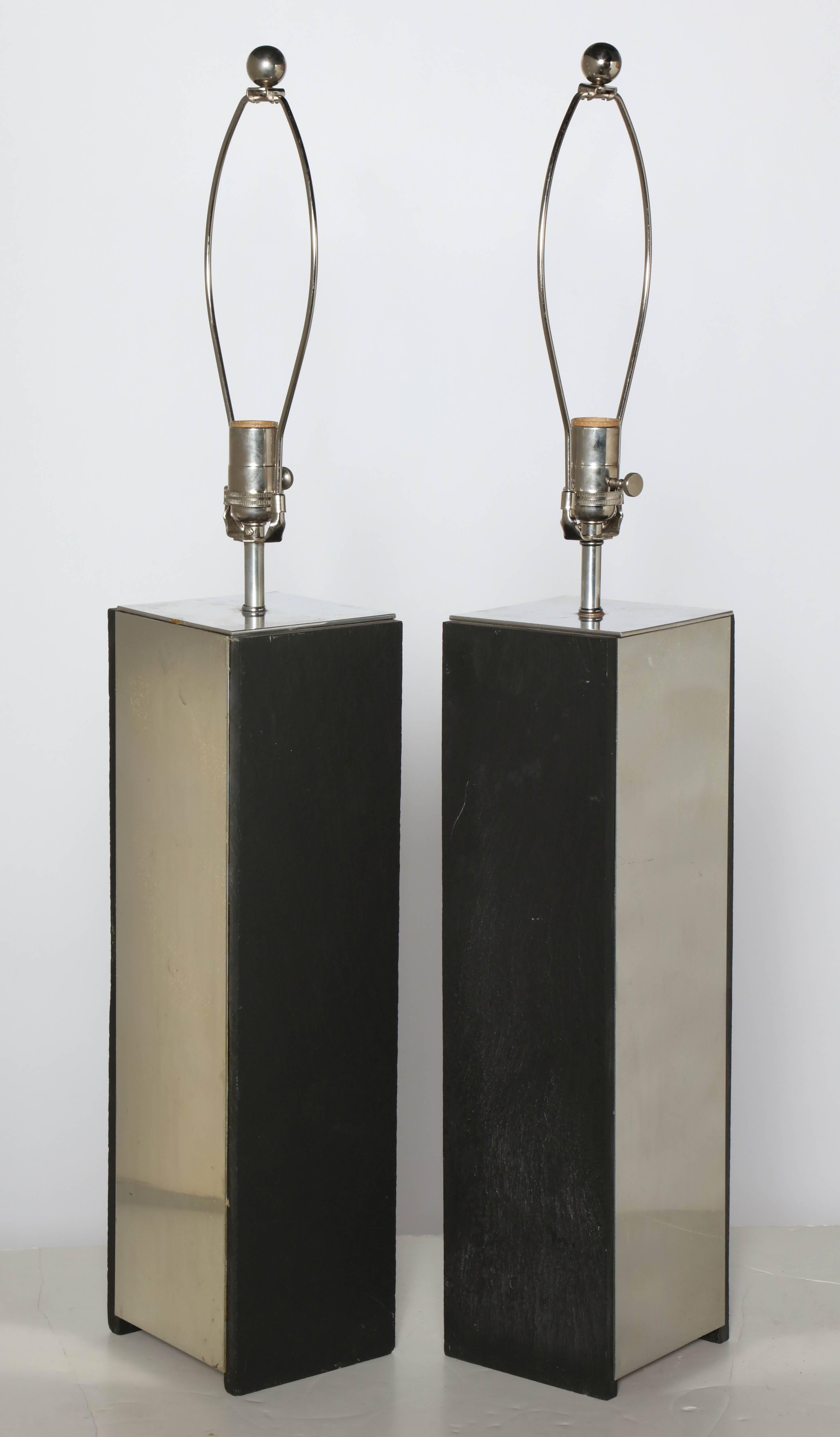 Tall Pair of International Style Laurel Lamp Company Black Slate and Aluminum Table Lamps.  Featuring two two sided vertical Black Slate and two two sided reflective Aluminum Panels. Each panel measures 19H. Architectural. Industrial. Statement