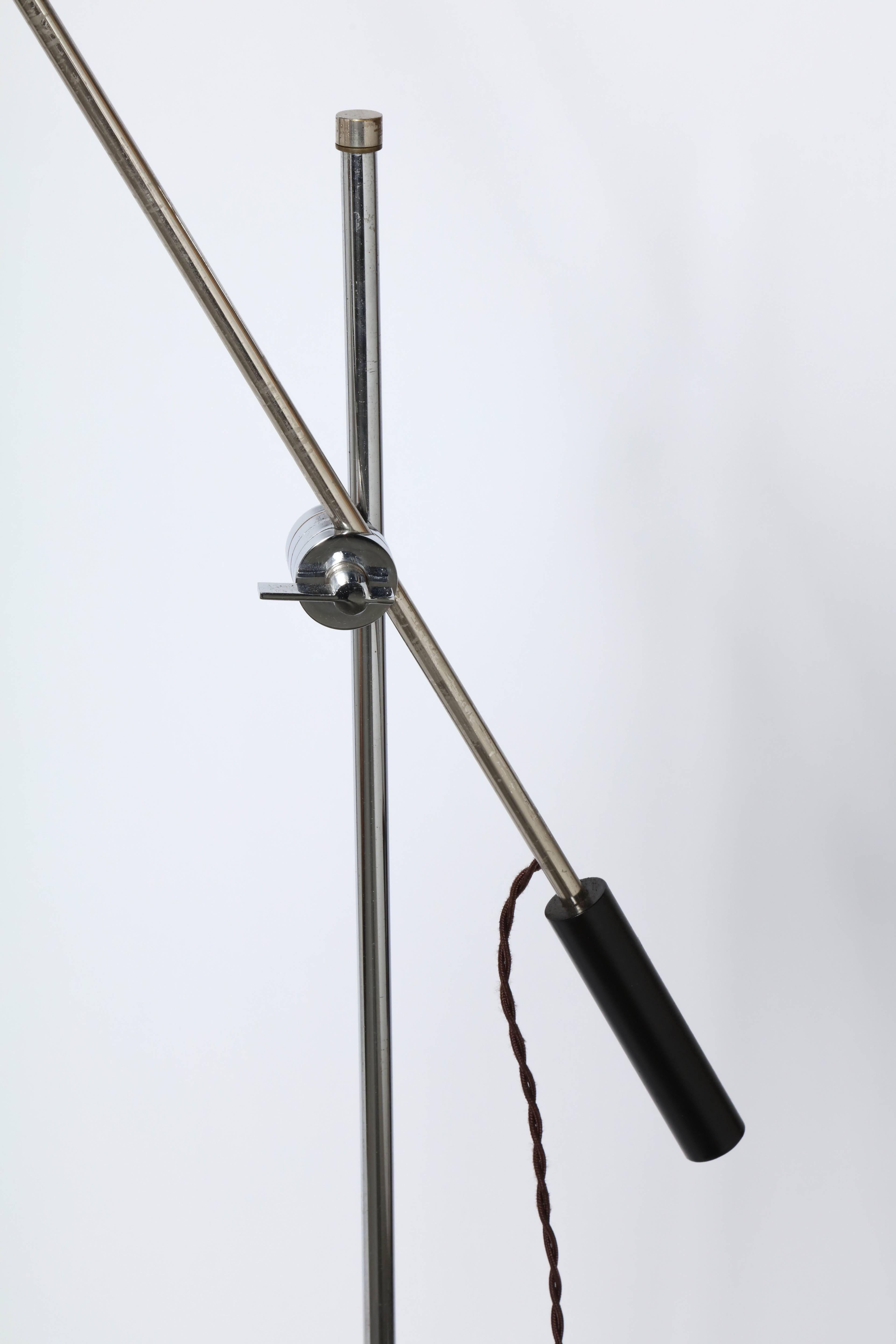 American Mid-Century Modern articulating Robert Sonneman attributed Laurel Lamp Co. Chrome and black enameled floor lamp. With black handle, base and shade. Featuring a 46H tubular chrome column, 40L adjustable black handled arm and adjustable knob.