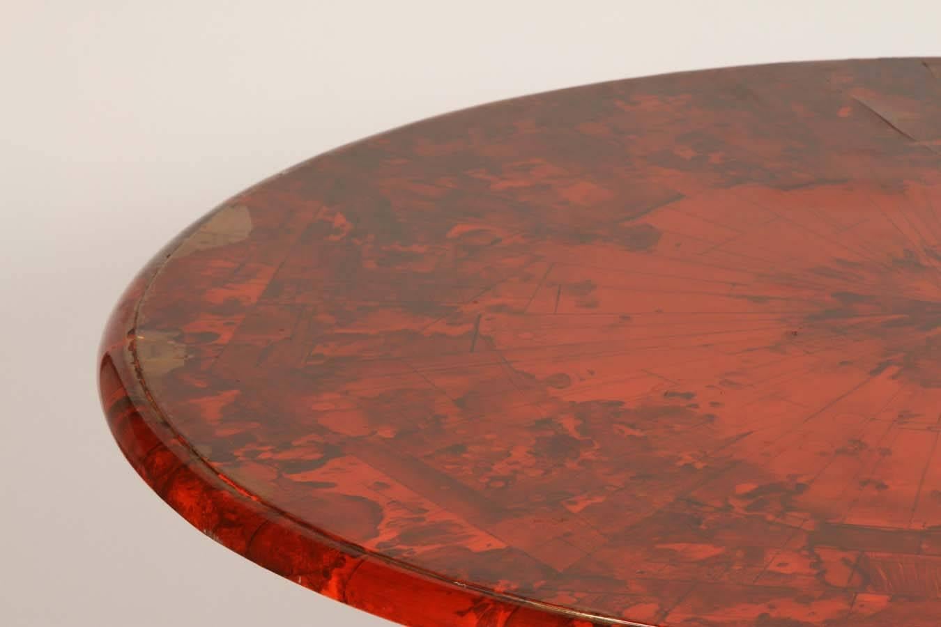 This beautiful lacquered table in a red faux bois finish is a show stopper. It would be a perfect dining table in a breakfast area.
