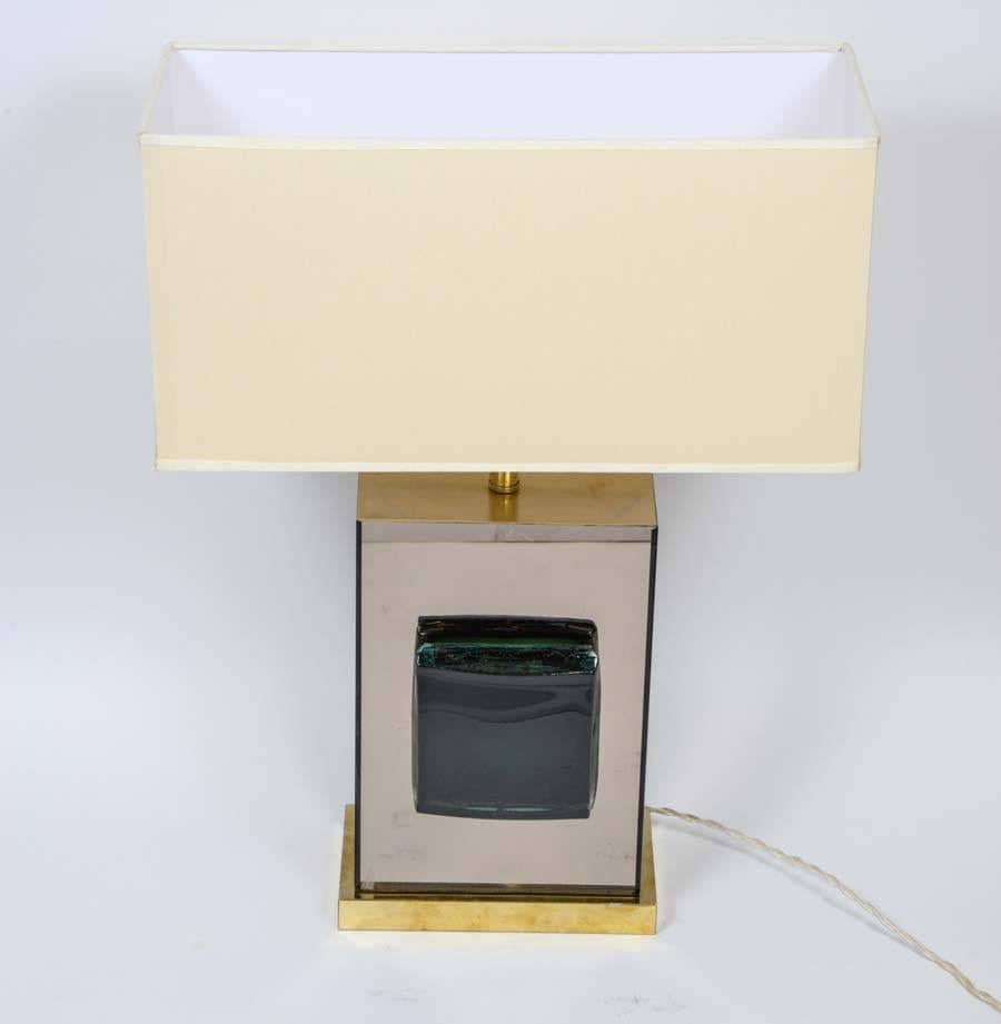 Pair of table lamps made of brass feet, rectangular mirror body and two big curved green Murano glass squares.