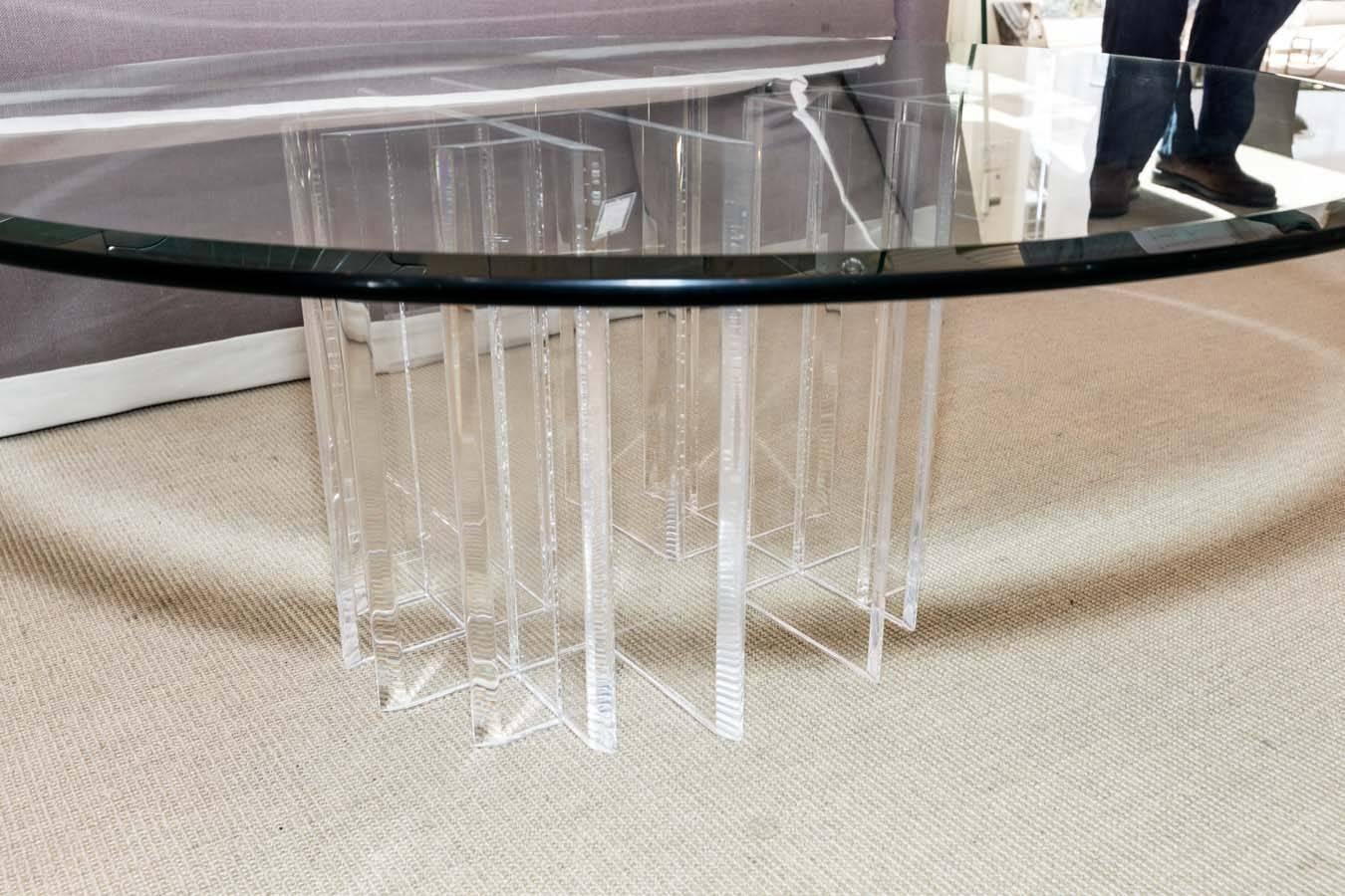 Mid-Century round coffee table with beveled glass top and two-part Lucite base.