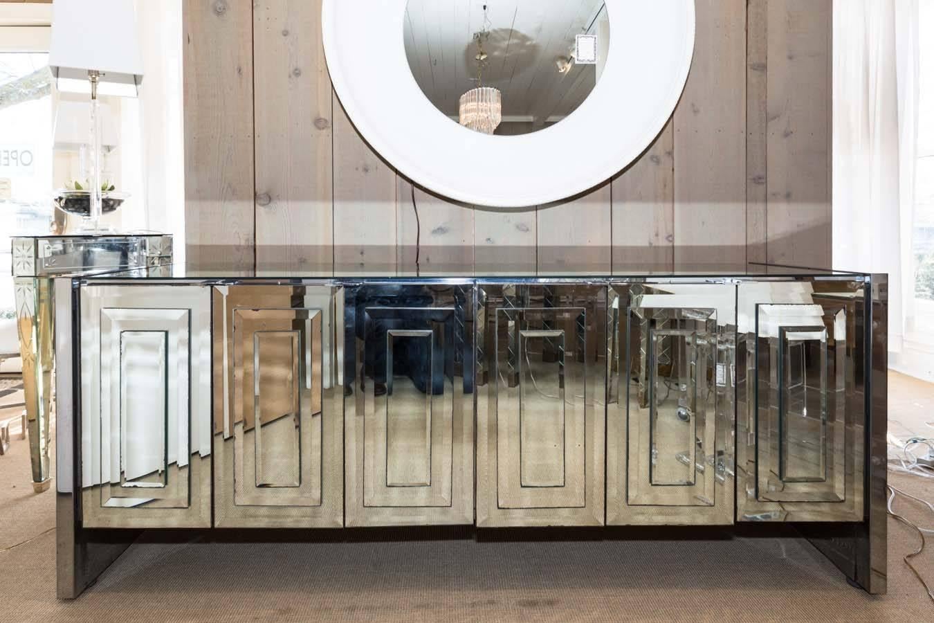 Fabulous Ello six-door mirrored credenza. There is one single door and one double door on each side. Opening the doors reveals three drawers on each side which is quite rare for this Ello piece.
