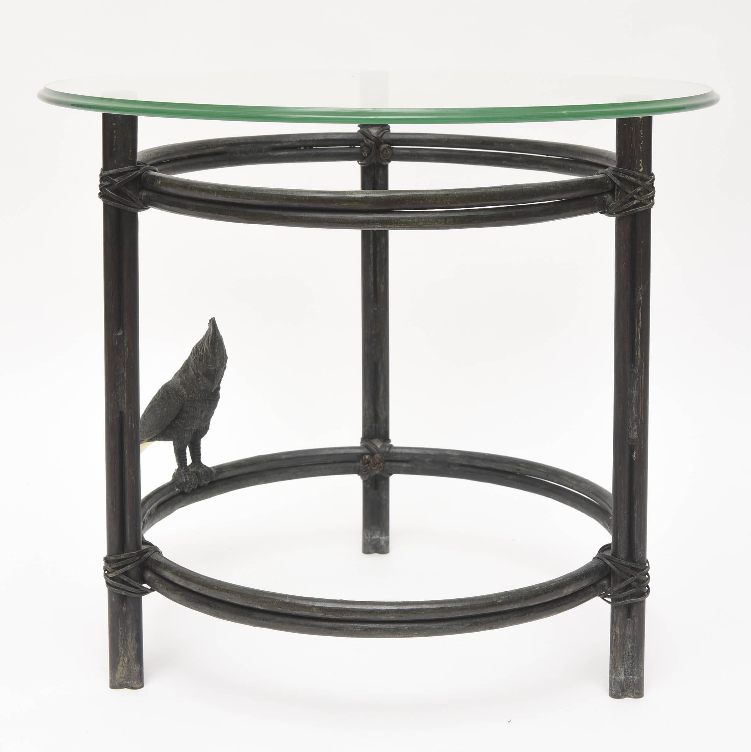 Original Maitland-Smith handmade solid bronze round side table with parrot figurine in the style of Diego Giacometti.
Heavy and made with great Craftsmanship.
Makers label on the table.