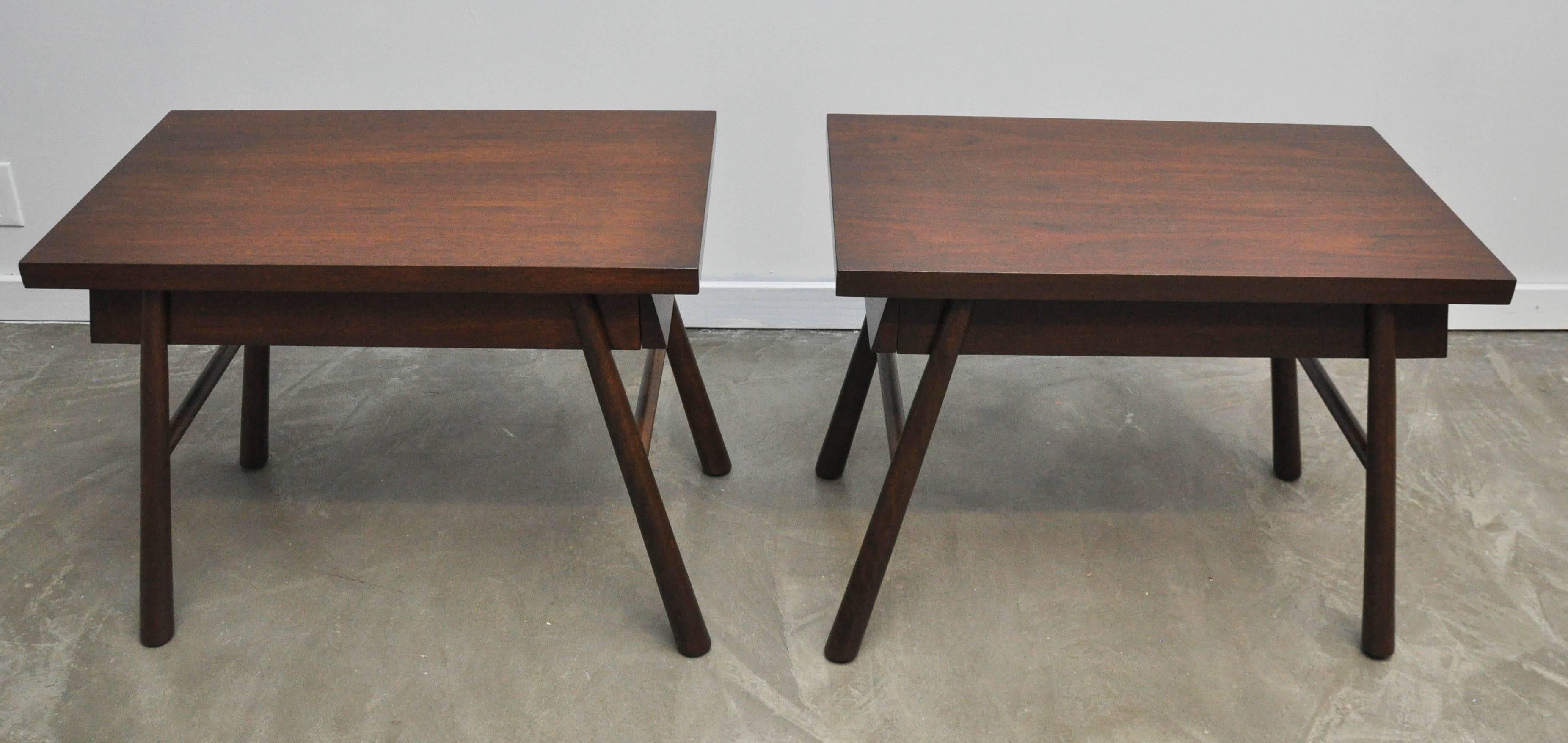 Pair of nightstand or end tables by T.H. Robsjohn-Gibbings. Fully restored and refinished in card walnut tone.