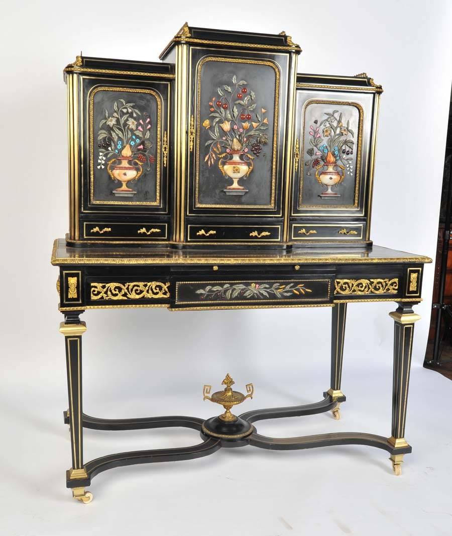A very good quality pair of Napoleon III Pietra Dura bonheur du jours. With semi precious stone inlaid to the doors and ormolu mounts.