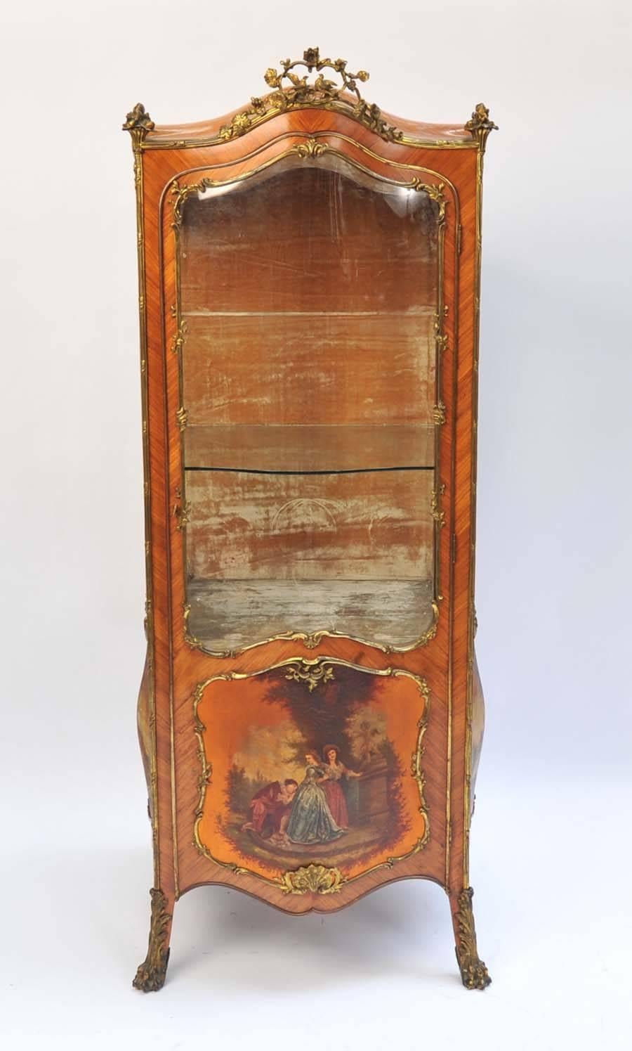 An unusual French 19th century kingwood, vernis martin vitrine in the style of a Sedan chair. Having serpentine glass to the front and sides. Bombe fronted painted panels, ormolu mounts and raised on out swept feet.
