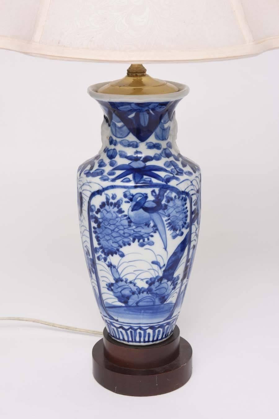 This pair of Chinese blue and white vases have been converted into table lamps. with their two-tiered bases, brass hardware and oval shades they make for the perfect set of lamps.

Note: 
Overall dimensions with shades 25.50