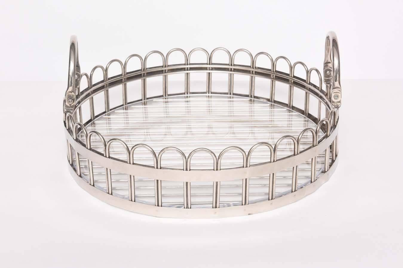 This stylish and substantial serving tray is by the iconic silver-maker Godinger. 

The piece has collapsible handles for ease of storage and a Lucite liner in the basket or tray that can be removed for cleaning.

For best net trade price or