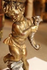 Venetian Giltwood Statue Supporting a Faux Marble Top