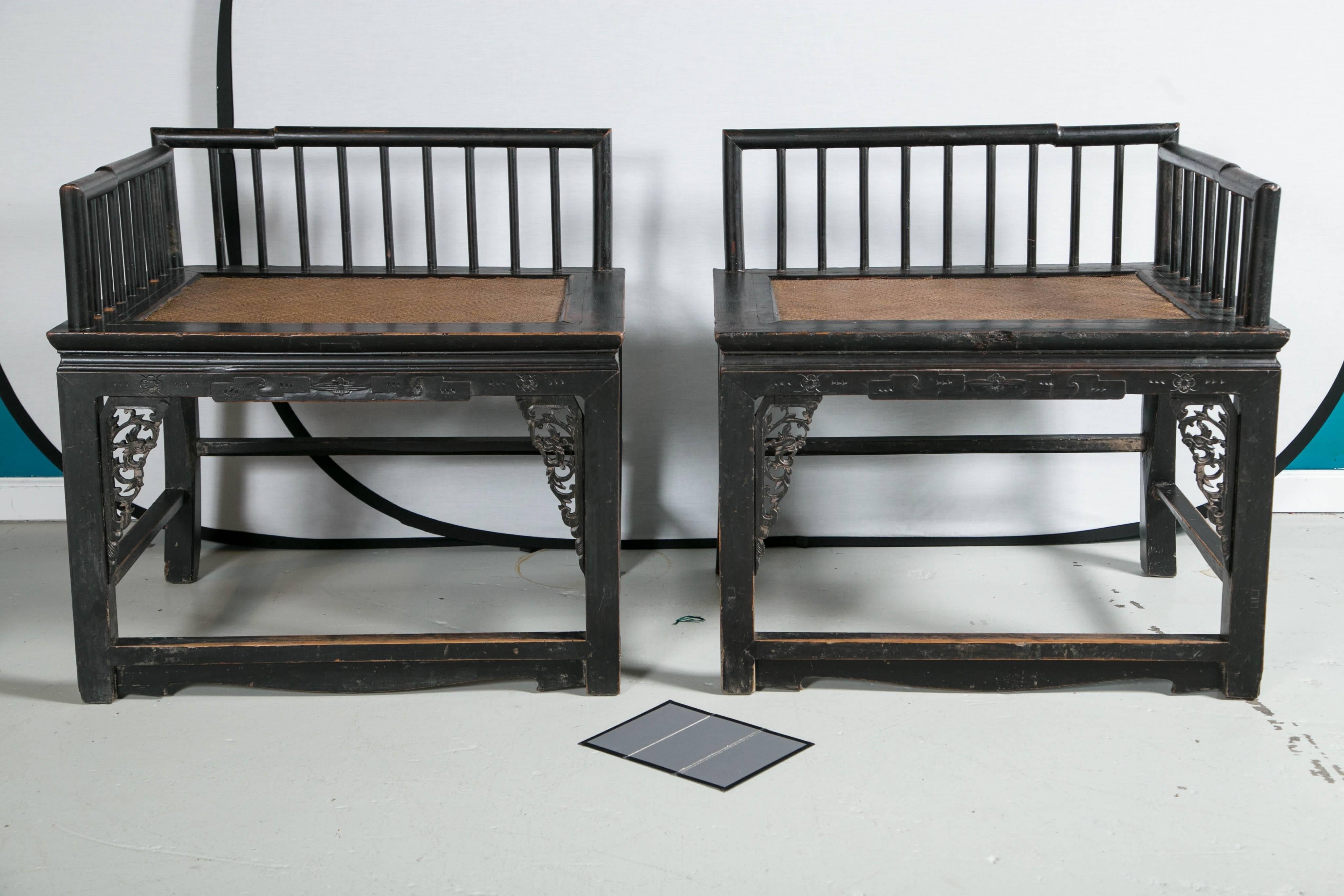 Pair of Southeast Asian dark wood carved chairs.