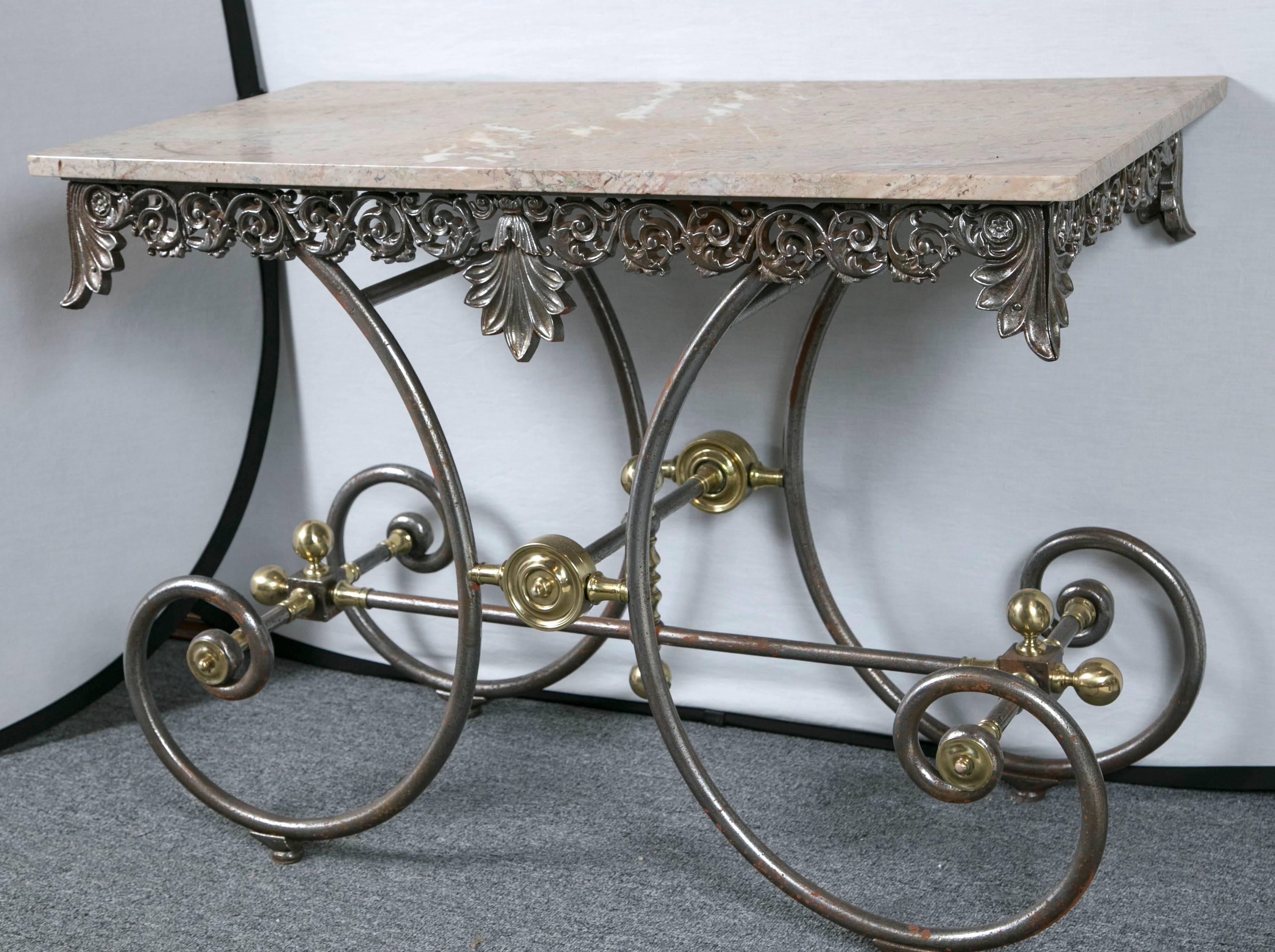 Marble-top Baker's table with pierced folite skirt, iron with brass details.
 
