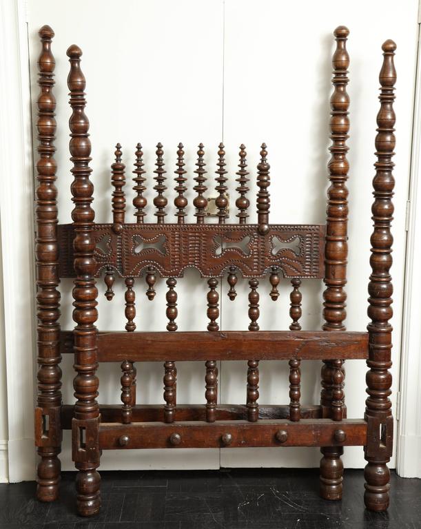 Portuguese 18th century mahogany bed, turned spindles, headboard and footboard, later side railings.