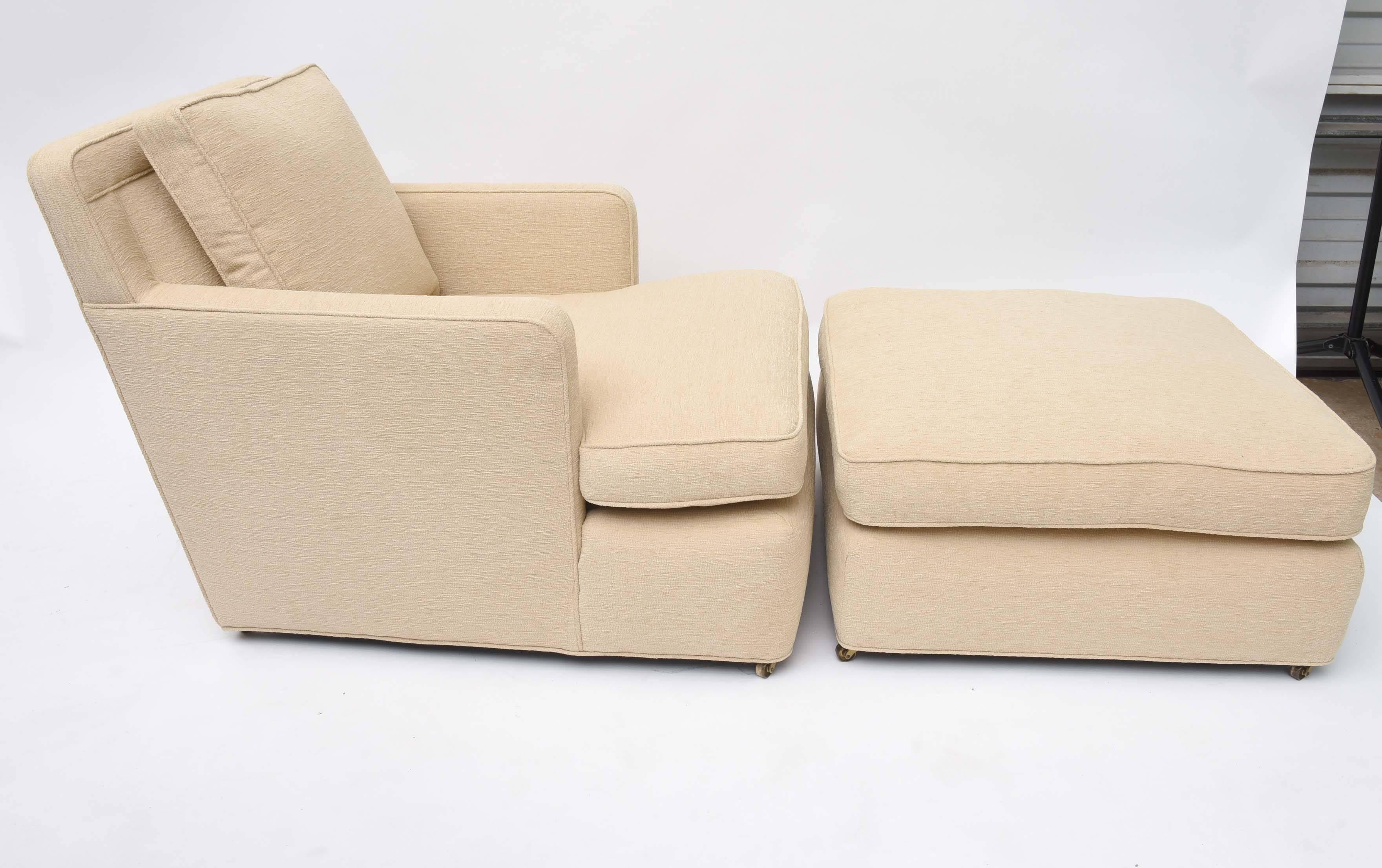 An oversized, comfortable lounge chair and ottoman.
Manufactured by Dunbar.