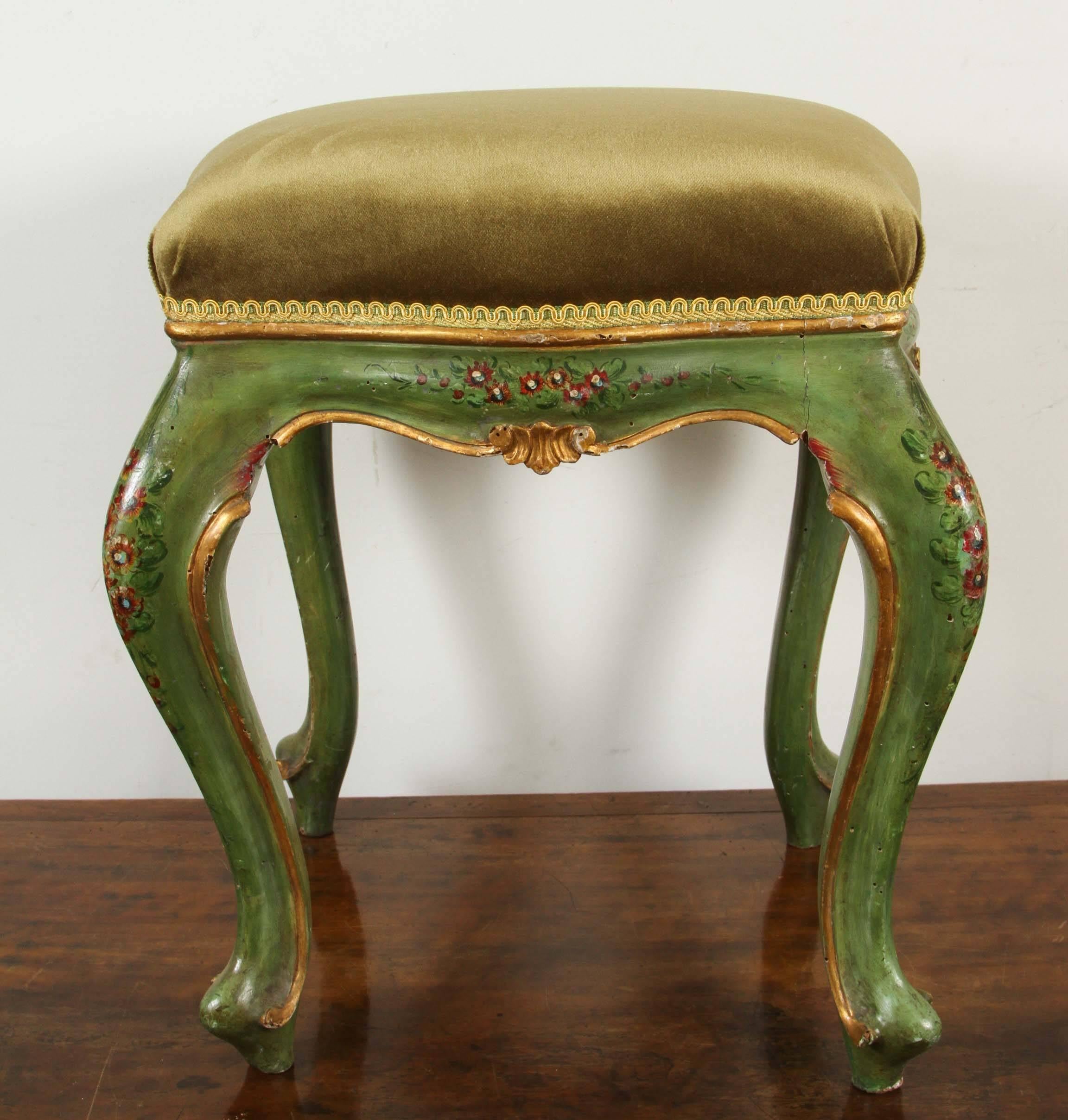 Two hand-painted, parcel-gilt, green Venetian stools in silk velvet on cabriole legs.