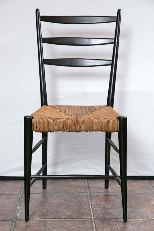 Set of Four Black Lacquer and Rattan Chairs For Sale at 1stdibs