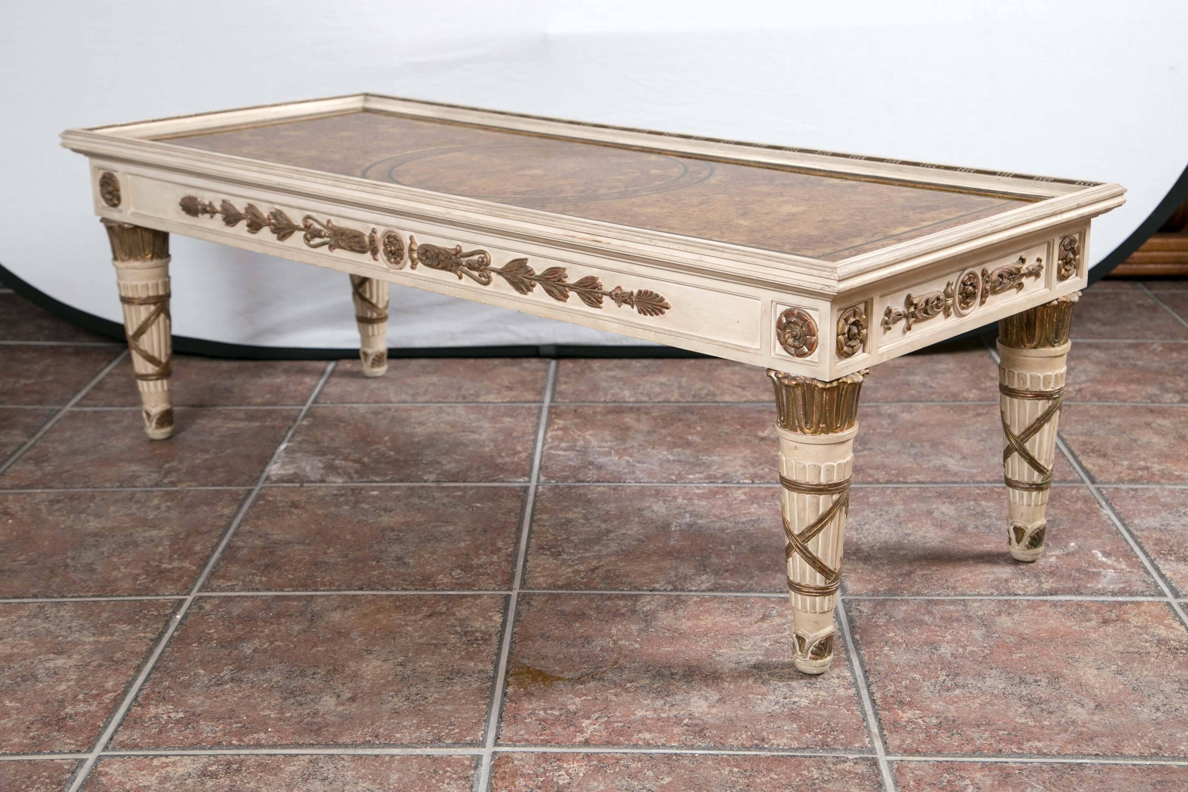 Maison Jansen Empire style coffee table having gilt decorated églomisé top over decorated apron.