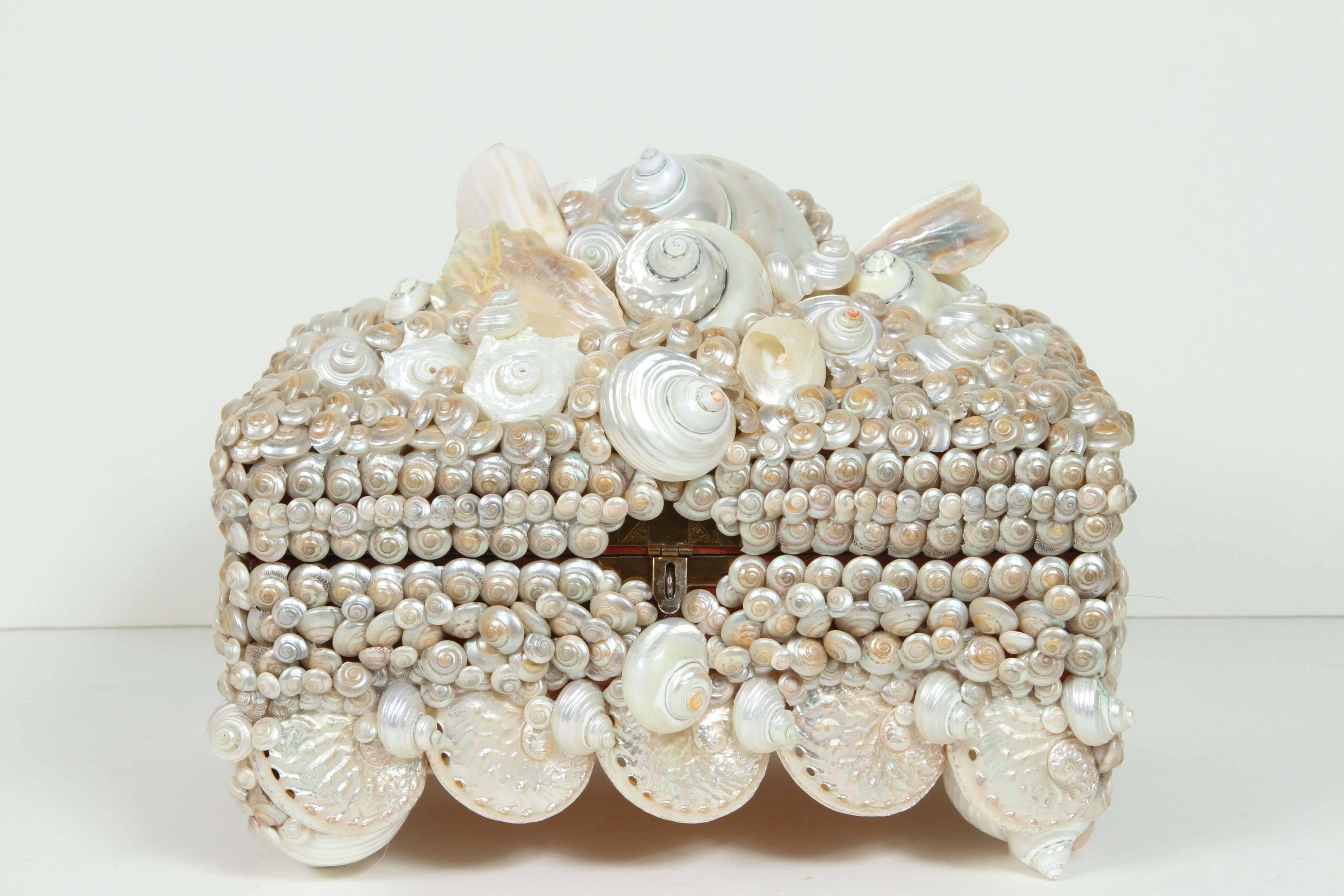 Beautiful shell encrusted box with silk lined interior.