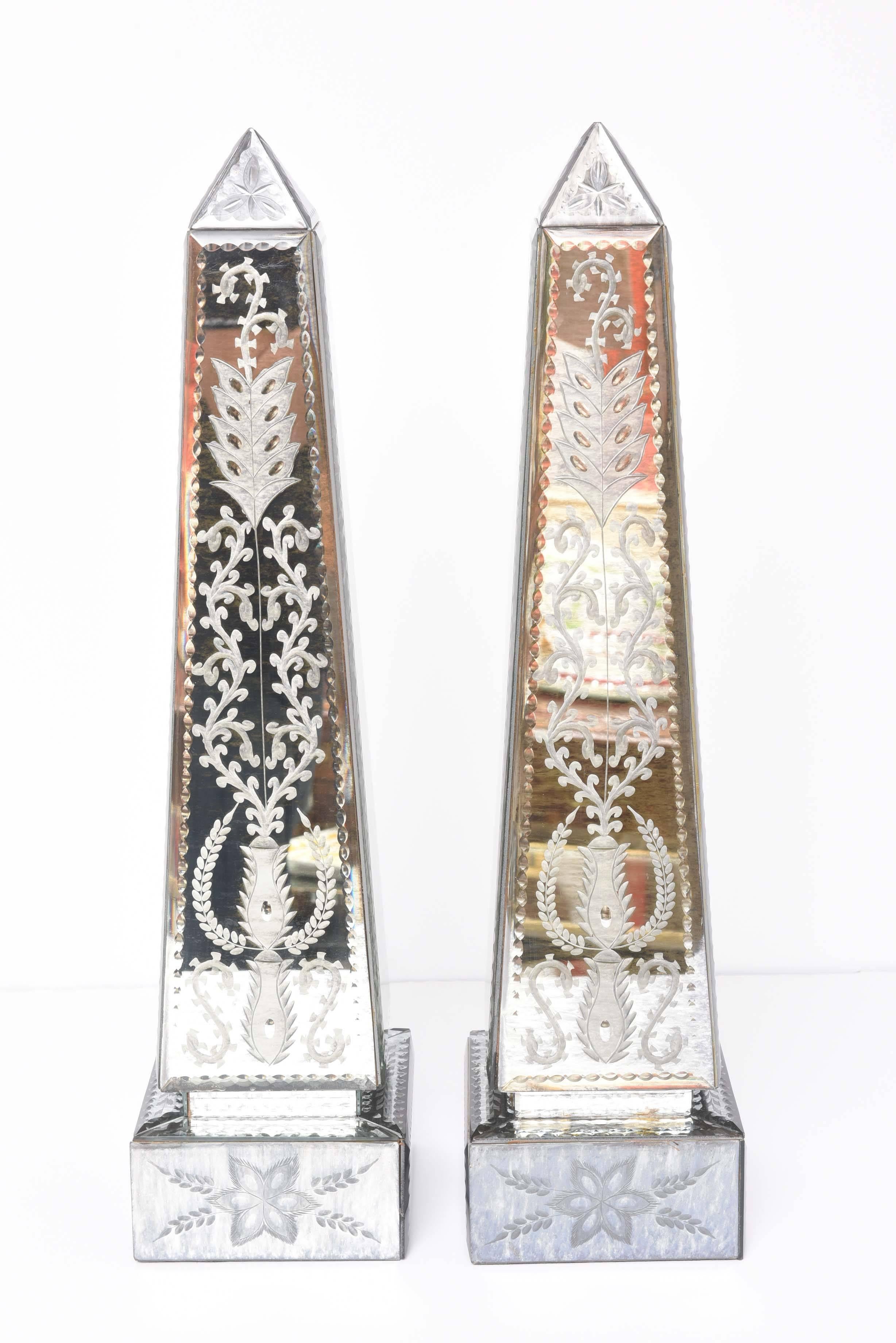 Elegantly etched large pair of mirrored obelisks.
