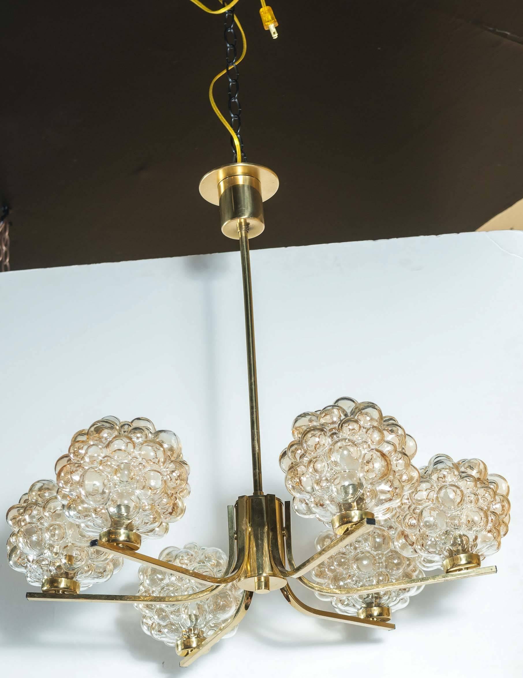 Vintage six-light amber bubble glass chandelier by Glashütte Limburg. Six lovely glass shades rest atop a polished brass frame. Newly wired, UL listing available for an additional fee.