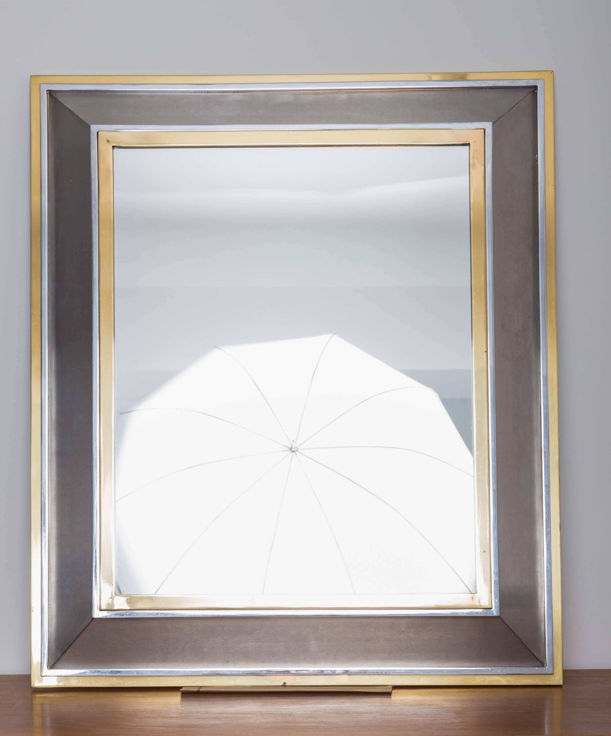 French mirror framed in metal and brass.
 
