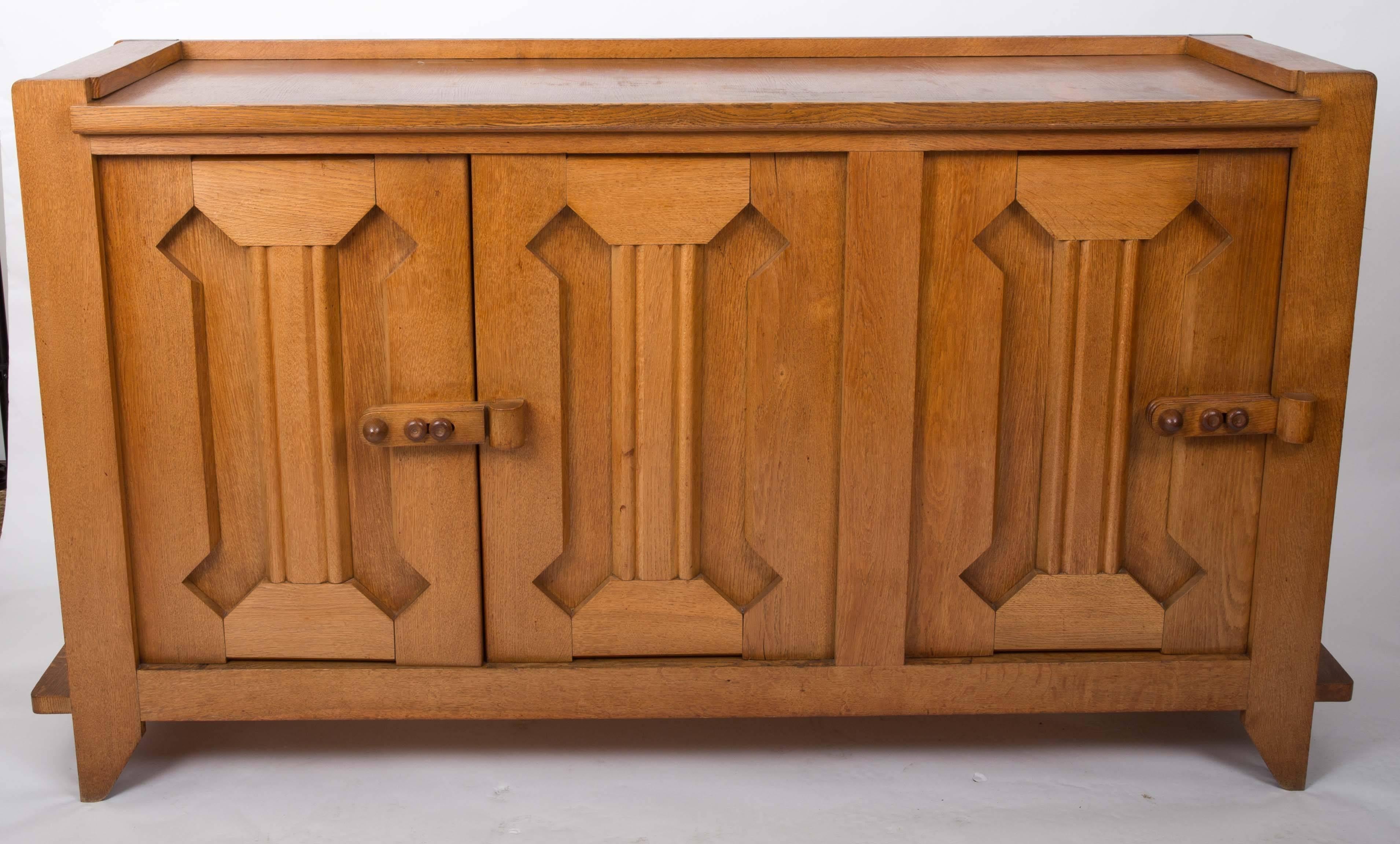 French oak credenza by Guillerme et Chambron with three doors and movable shelves inside.