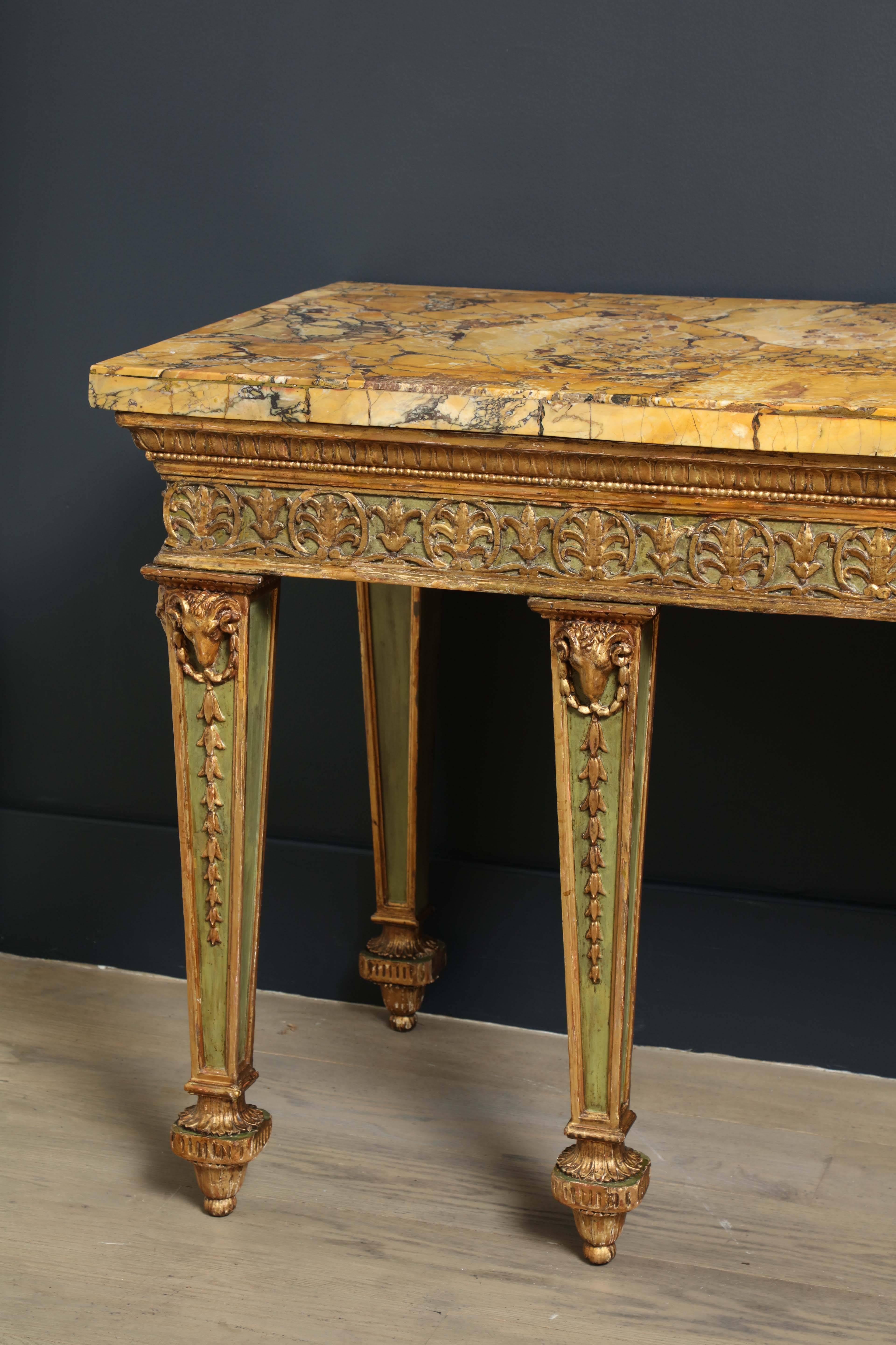 This stunning 18th century Sienna marble top, likely acquired on a Grand Tour trip, is supported on a well proportioned nineteenth century Stand with anthemion and lotus carved frieze raised on tapering legs with rams heads and pendant husks ending