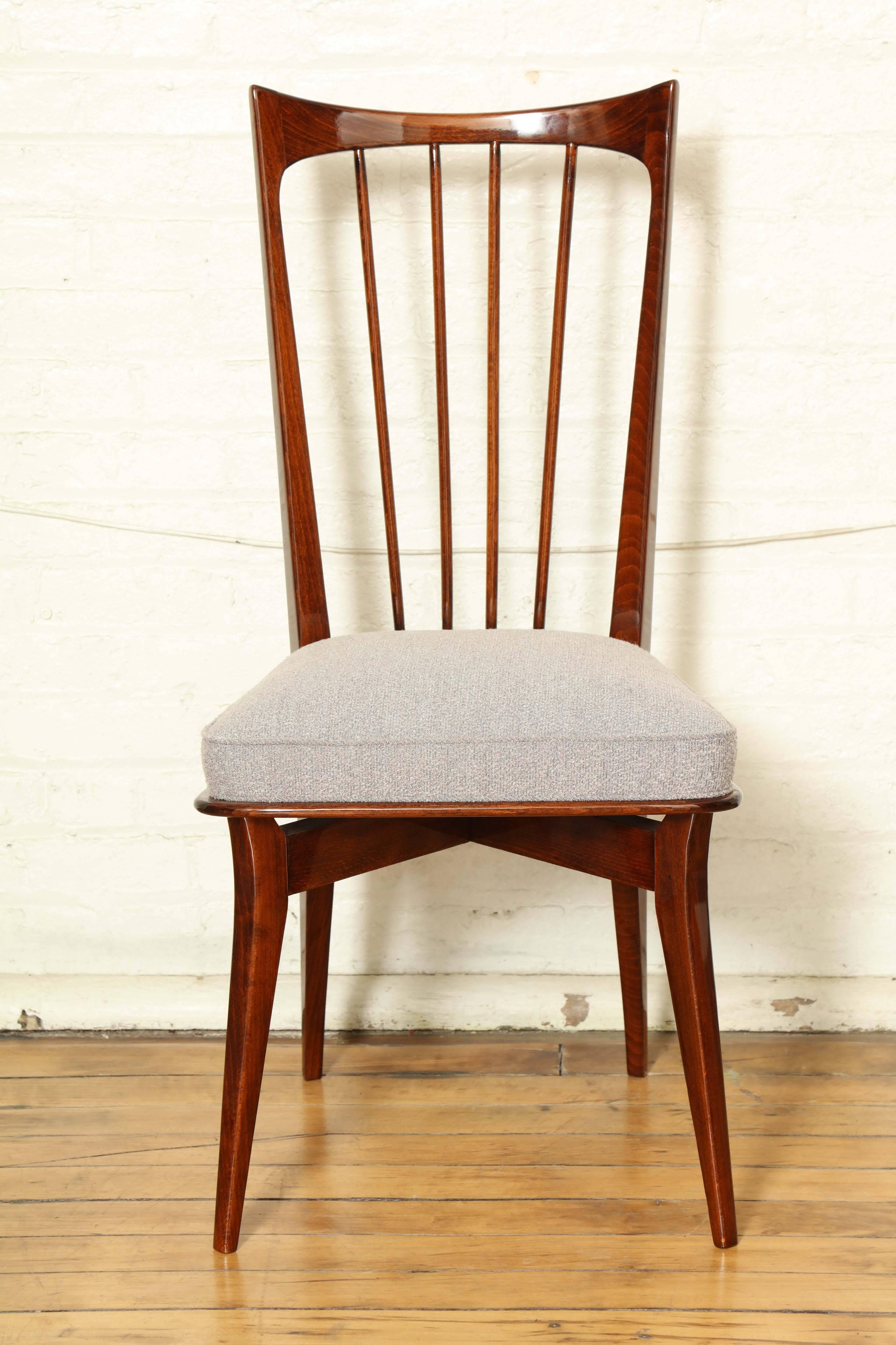Mid-Century Modern dining chairs / suite four refinished and newly upholstered in an Italian wool fabric.