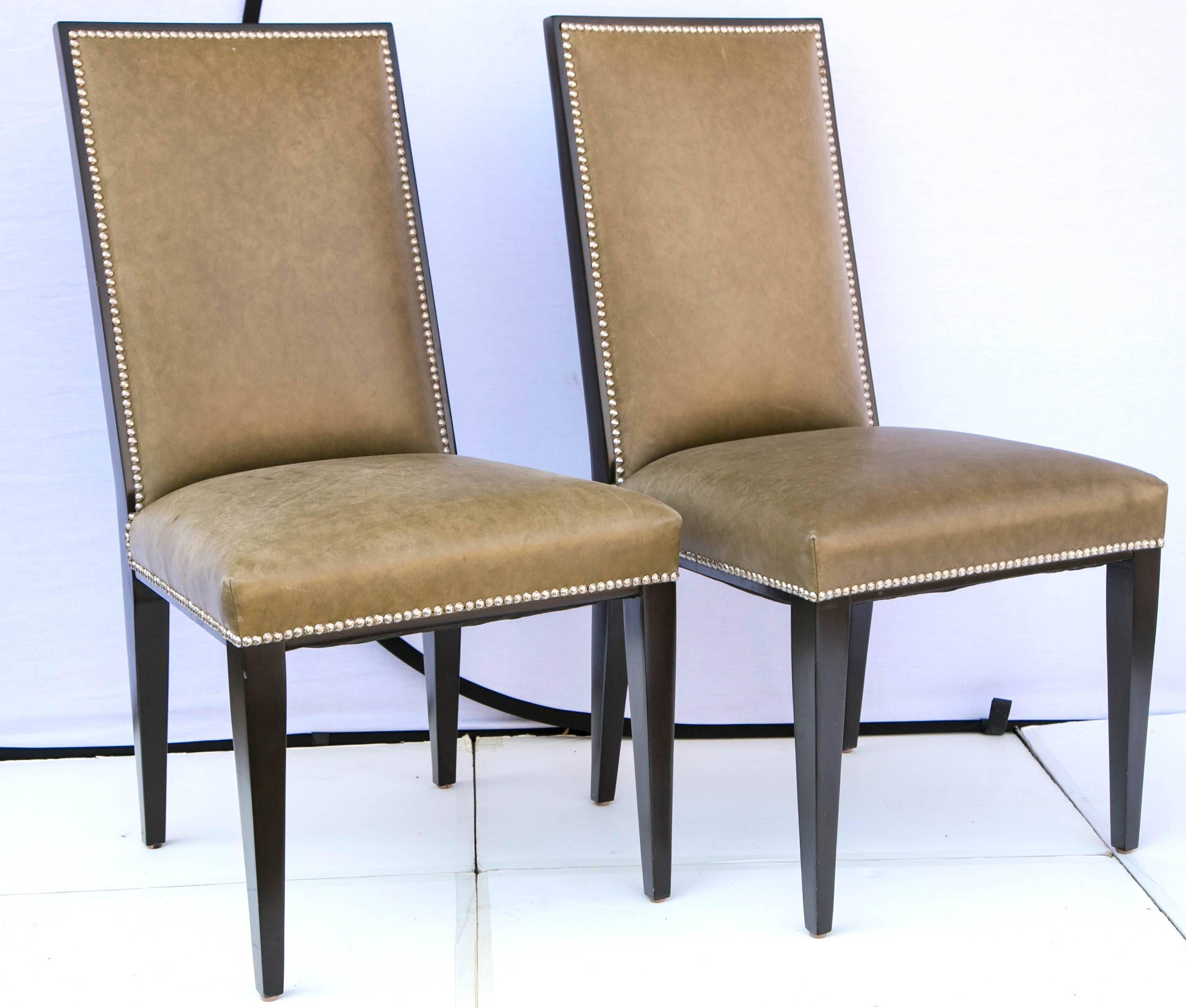 Set of Eight  Modern Taupe Green Leather Dining Chair Style of Ralph Lauren. The legs are a hardwood stained Espresso. The perimeters of the chairs are decorated with nail head design and a hardwood Espresso frame. The leather is in a soft calm
