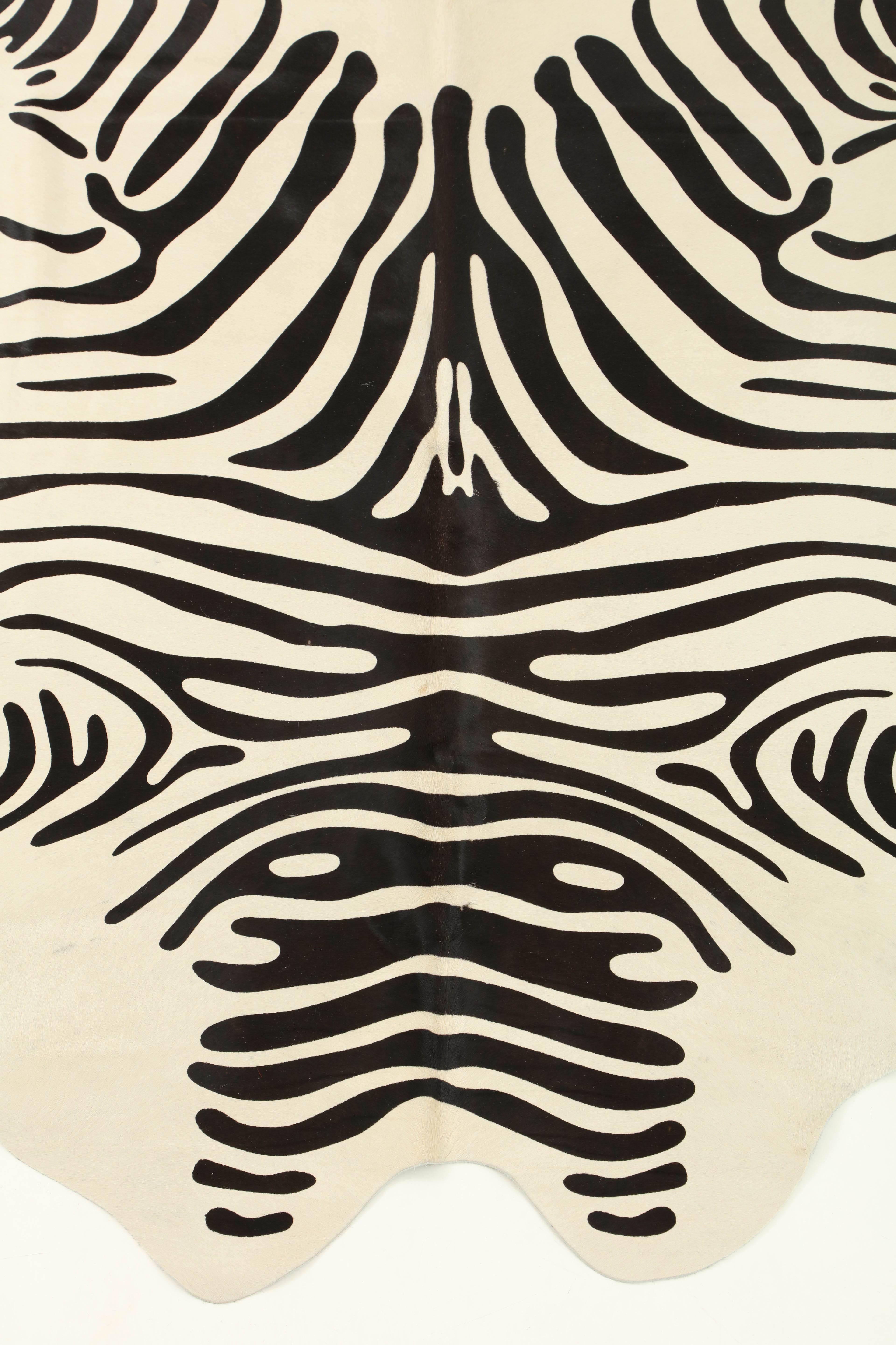 This stenciled zebra print Brazilian cowhide rug is made with 100% natural materials. Their tanneries are ISO-9001 certified for quality and ISO 14001 certified for low environmental impact which is what gives them their gold star rating from